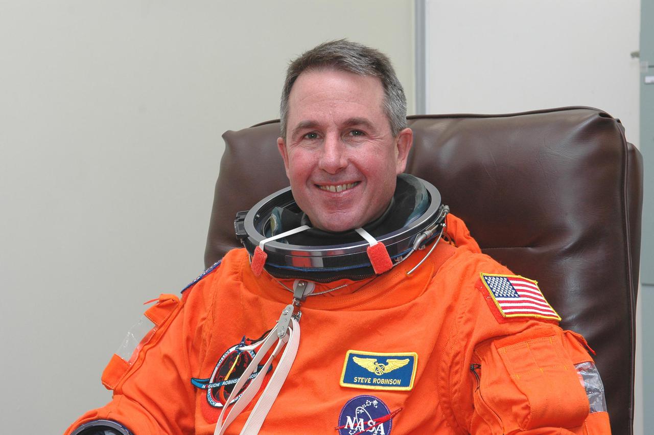 KENNEDY SPACE CENTER, FLA. - In the Operations and Checkout Building at NASA’s Kennedy Space Center, the Return to Flight STS-114 crew suits up in preparation for launch aboard Space Shuttle Discovery. Seen here is Mission Specialist Stephen Robinson, who is making his third Space Shuttle flight. The crew is scheduled to launch on this historic mission at 3:51 p.m. EDT today from Launch Pad 39B. It is the 114th Space Shuttle flight and the 31st for Discovery. The 12-day mission is expected to end with touchdown at the Shuttle Landing Facility at 11:06 a.m. July 25.