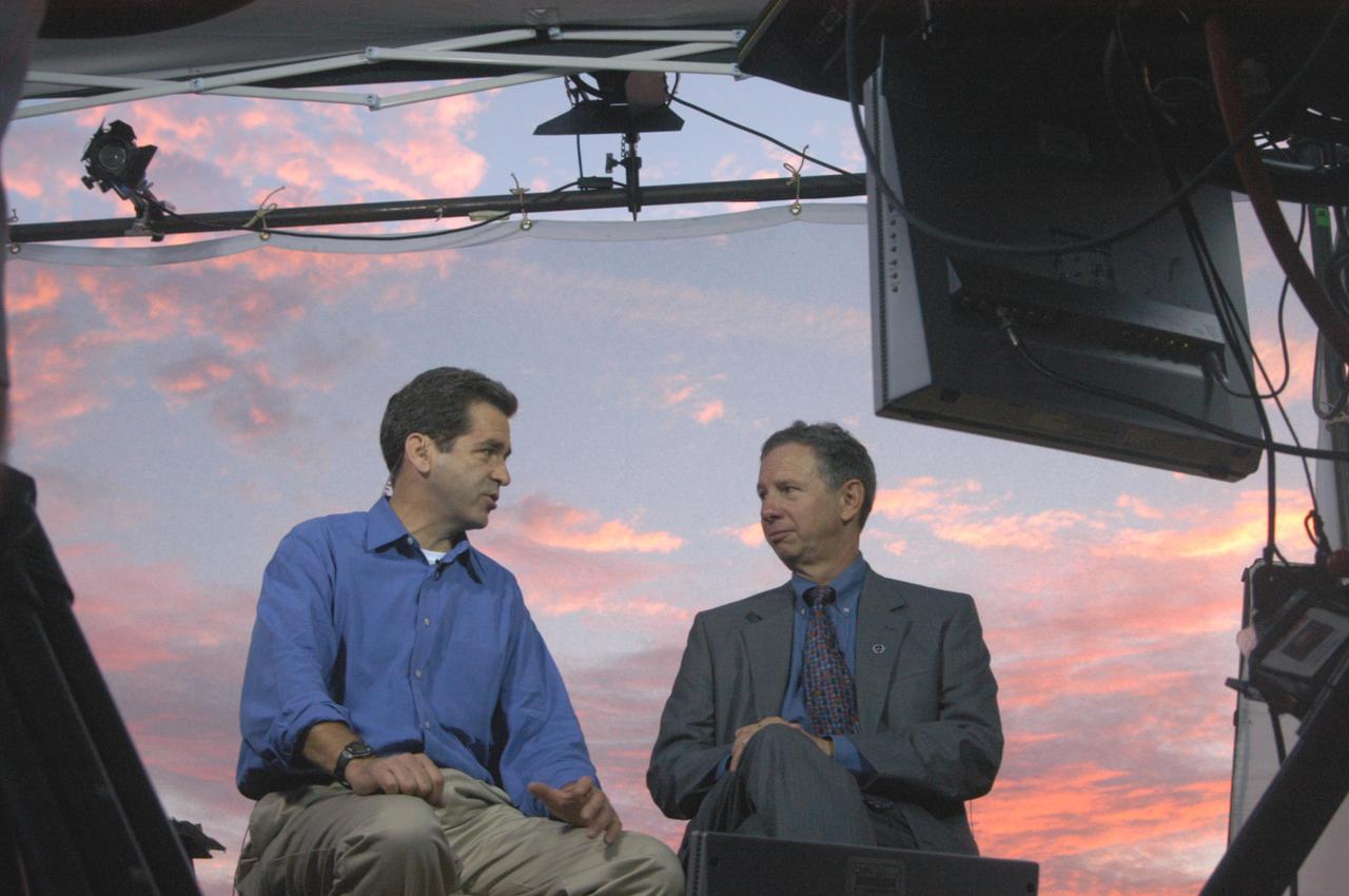 KENNEDY SPACE CENTER, FLA. -   Against a sunrise-painted sky at NASA Kennedy Space Center, co-anchor on CNN’s American Morning, talks on air with NASA Administrator Mike Griffin about the pending 3:51 p.m. launch of Space Shuttle Discovery on the historic Return to Flight mission STS-114.  It is the 114th Space Shuttle flight and the 31st for Discovery.  The 12-day mission is expected to end with touchdown at the Shuttle Landing Facility at 11:06 a.m. July 25.
