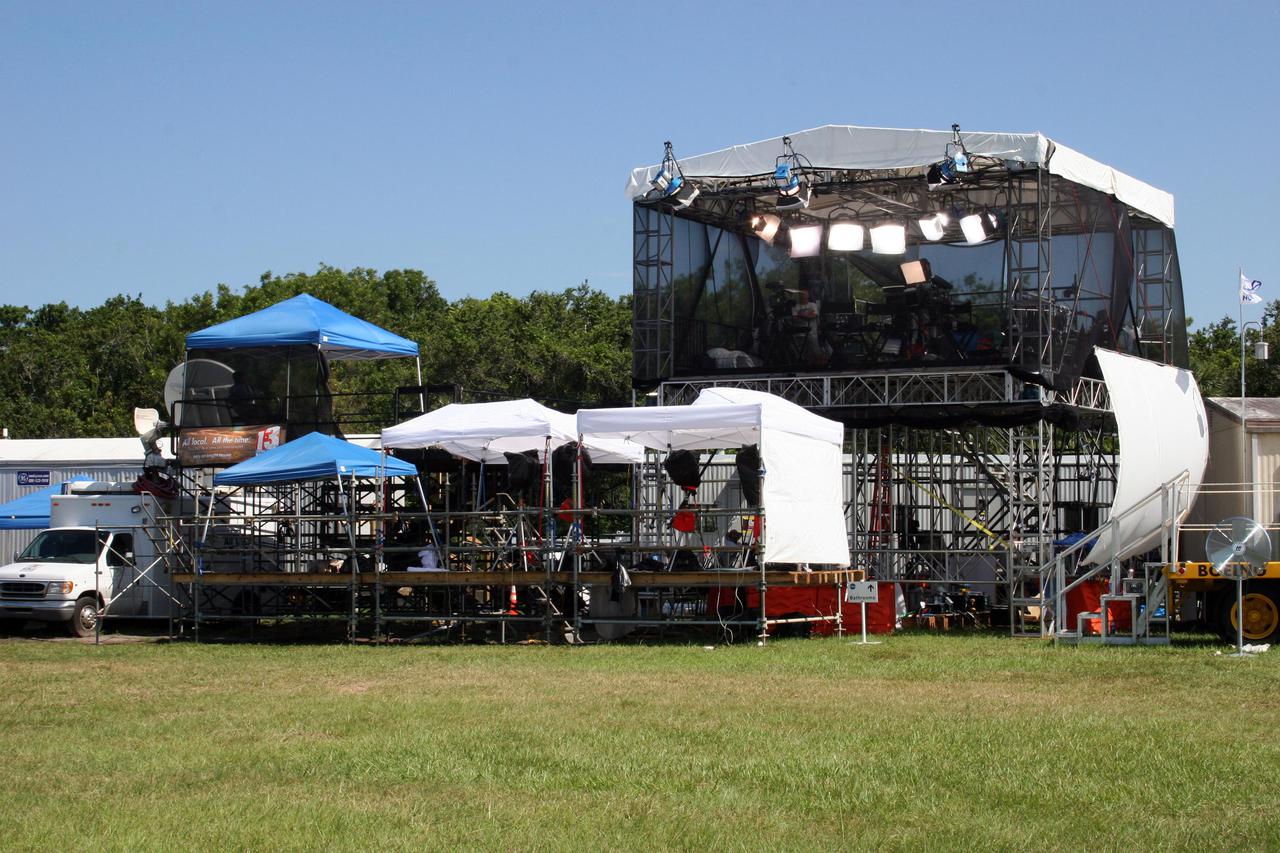 KENNEDY SPACE CENTER, FLA. -   Tents cover precious equipment in the area east of the NASA Kennedy Space Center News Center where photographers and other media wait for the launch of Space Shuttle Discovery on Return to Flight mission STS-114.  More than a thousand media representatives from 36 states, the District of Columbia and 32 countries converged on the News Center for the historic launch.