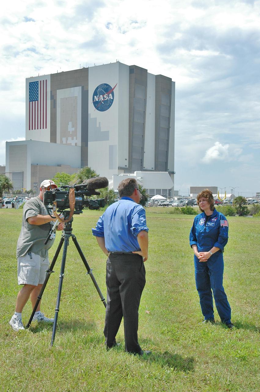 KENNEDY SPACE CENTER, FLA. -   Astronaut Catherine “Cady” Coleman is interviewed in the NASA News Center at NASA Kennedy Space Center by a television reporter during launch activities for Return to Flight mission STS-114. Coleman has flown on two Shuttle missions, STS-73 and STS-93.  More than a thousand media representatives from 36 states, the District of Columbia and 32 countries converged on the News Center for the historic launch.
