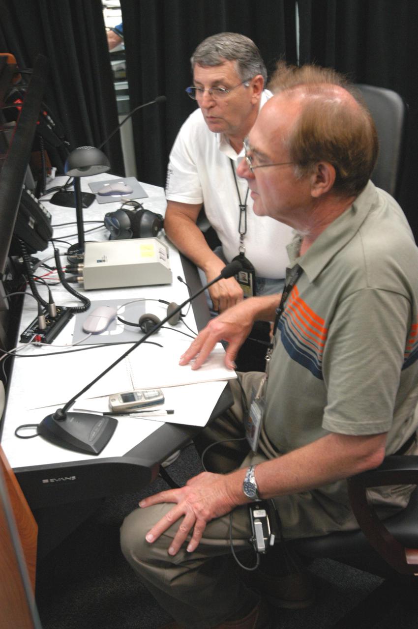 KENNEDY SPACE CENTER, FLA. -   At the Atlas V Spaceflight Operations Center, the launch team goes through a wet dress rehearsal for launch of the Mars Reconnaissance Orbiter (MRO), scheduled for Aug. 10.  At right, in the foreground, is NASA’s Public Information Officer George Diller, who is commentator for launches of NASA payloads on expendable launch vehicles. Launch of the MRO aboard an Atlas V rocket will be from Launch Complex 41 at Cape Canaveral Air Force Station in Florida.  A wet rehearsal includes pre-liftoff operations and fueling the rocket’s engine. The MRO was built by Lockheed Martin for NASA Jet Propulsion Laboratory in California.  It is the next major step in Mars exploration and scheduled for launch from Cape Canaveral Air Force Station. The MRO is an important next step in fulfilling NASA’s vision of space exploration and ultimately sending human explorers to Mars and beyond.