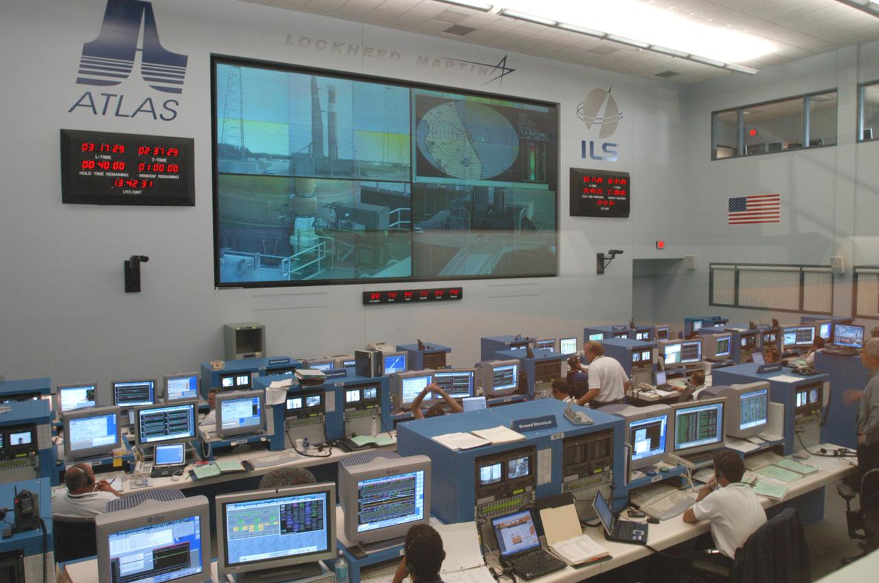 KENNEDY SPACE CENTER, FLA. -   At the Atlas V Spaceflight Operations Center, the launch team goes through a wet dress rehearsal for launch of the Mars Reconnaissance Orbiter (MRO), scheduled for Aug. 10.   Launch of the MRO aboard an Atlas V rocket will be from Launch Complex 41 at Cape Canaveral Air Force Station in Florida.  A wet rehearsal includes pre-liftoff operations and fueling the rocket’s engine. The MRO was built by Lockheed Martin for NASA Jet Propulsion Laboratory in California.  It is the next major step in Mars exploration and scheduled for launch from Cape Canaveral Air Force Station. The MRO is an important next step in fulfilling NASA’s vision of space exploration and ultimately sending human explorers to Mars and beyond.