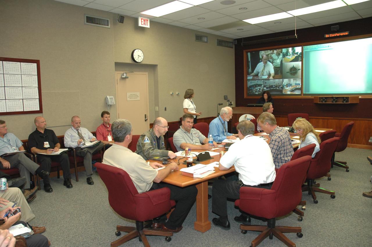 KENNEDY SPACE CENTER, FLA. -    The Mission Management Team gathers in NASA Kennedy Space Center’s Headquarters Building to review the findings about the faulty Engine Cut-Off sensor reading in last week’s launch attempt for Return to Flight mission STS-114.  Seated at the head of the table at left is Bill Parsons, Space Shuttle program manager.  A press briefing is scheduled for late in the day.
