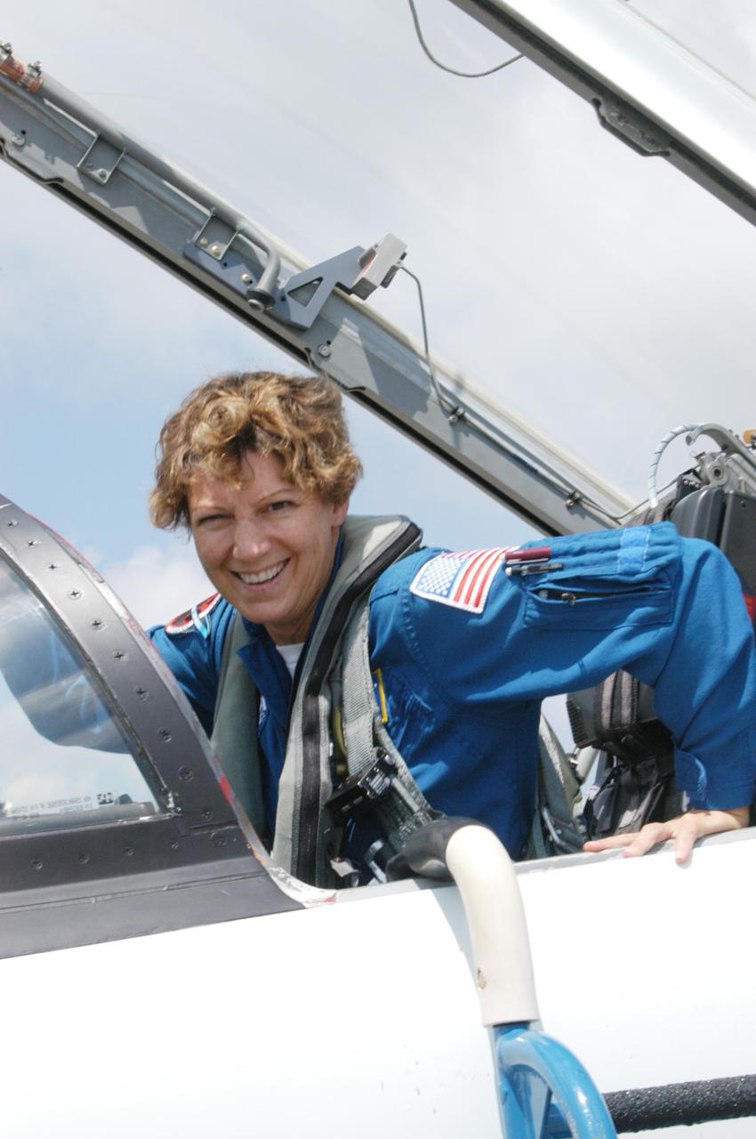 KENNEDY SPACE CENTER, FLA. -   The Return to Flight STS-114 crew arrives at NASA Kennedy Space Center in T-38 training jets to get ready for a second launch attempt aboard Space Shuttle Discovery.  Mission Commander Eileen Collins, climbing out of her jet, later told the media who waited nearby that since the scrub on July 13, the crew has focused on the on-orbit part of the mission and training for night landings using the Shuttle Training Aircraft.  She praised the engineers and technicians who have been troubleshooting the elusive sensor problem and thanked them.  STS-114 is scheduled to launch July 26 at 10:39 a.m. EDT from Launch Pad 39B.