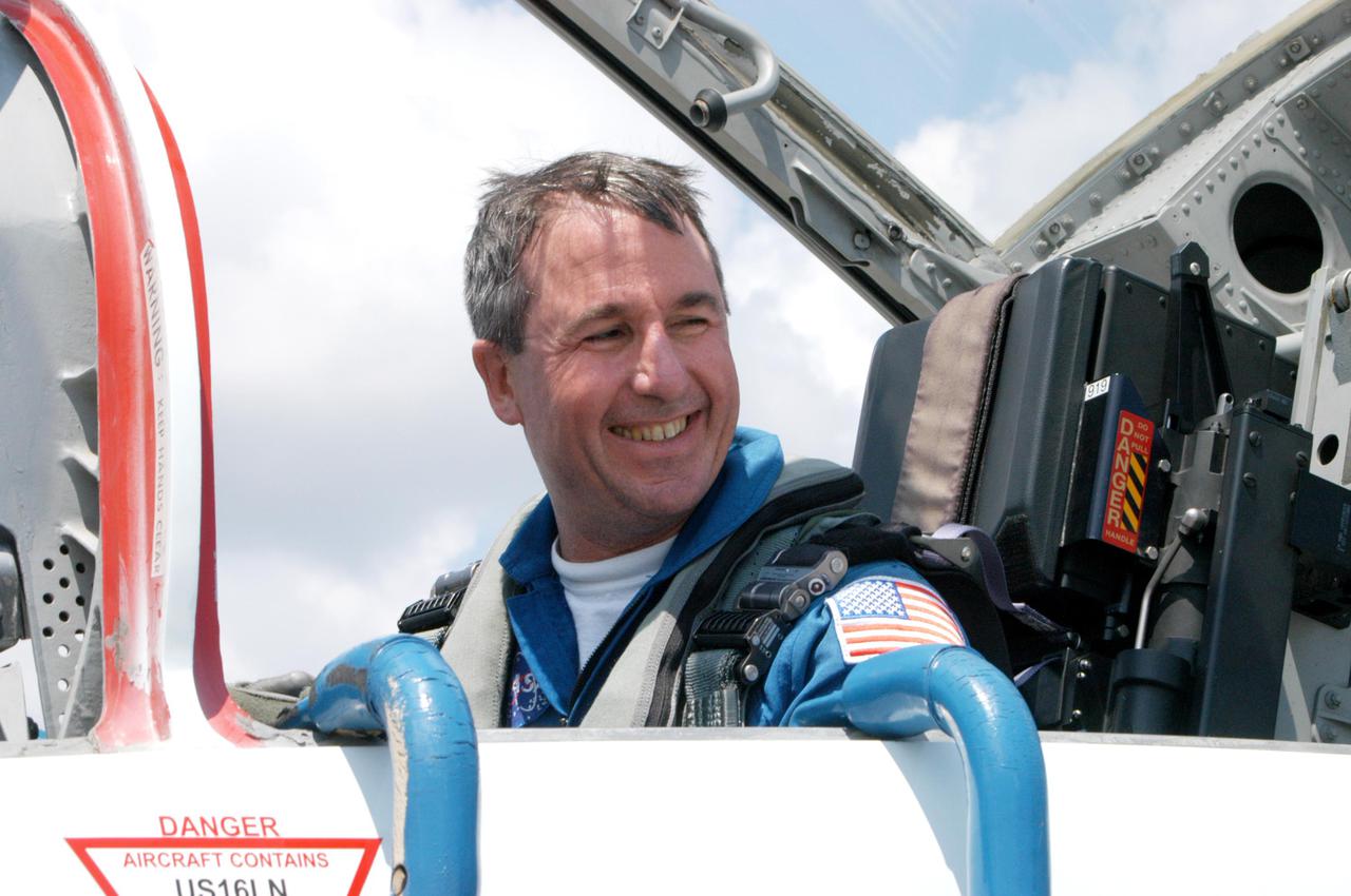 KENNEDY SPACE CENTER, FLA. -    The Return to Flight STS-114 crew arrives at NASA Kennedy Space Center in T-38 training jets to get ready for a second launch attempt aboard Space Shuttle Discovery.  Seen in the photo is Mission Specialist Stephen Robinson, still in the T-38 jet. Mission Commander Eileen Collins later told the media who waited nearby that since the scrub on July 13, the crew has focused on the on-orbit part of the mission and training for night landings using the Shuttle Training Aircraft.  She praised the engineers and technicians who have been troubleshooting the elusive sensor problem and thanked them.  STS-114 is scheduled to launch July 26 at 10:39 a.m. EDT from Launch Pad 39B.