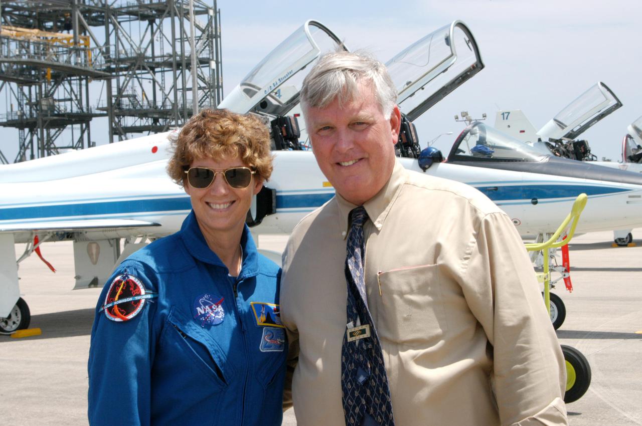 KENNEDY SPACE CENTER, FLA. -   Center Director Jim Kennedy (right) greets STS-114 Mission Commander Eileen Collins after her arrival at NASA Kennedy Space Center aboard a T-38 jet aircraft.  The Return to Flight STS-114 crew has returned to KSC to get ready for a second launch attempt aboard Space Shuttle Discovery.  Collins later told the media who waited nearby that since the scrub on July 13, the crew has focused on the on-orbit part of the mission and training for night landings using the Shuttle Training Aircraft.  She praised the engineers and technicians who have been troubleshooting the elusive sensor problem and thanked them.  STS-114 is scheduled to launch July 26 at 10:39 a.m. EDT from Launch Pad 39B.