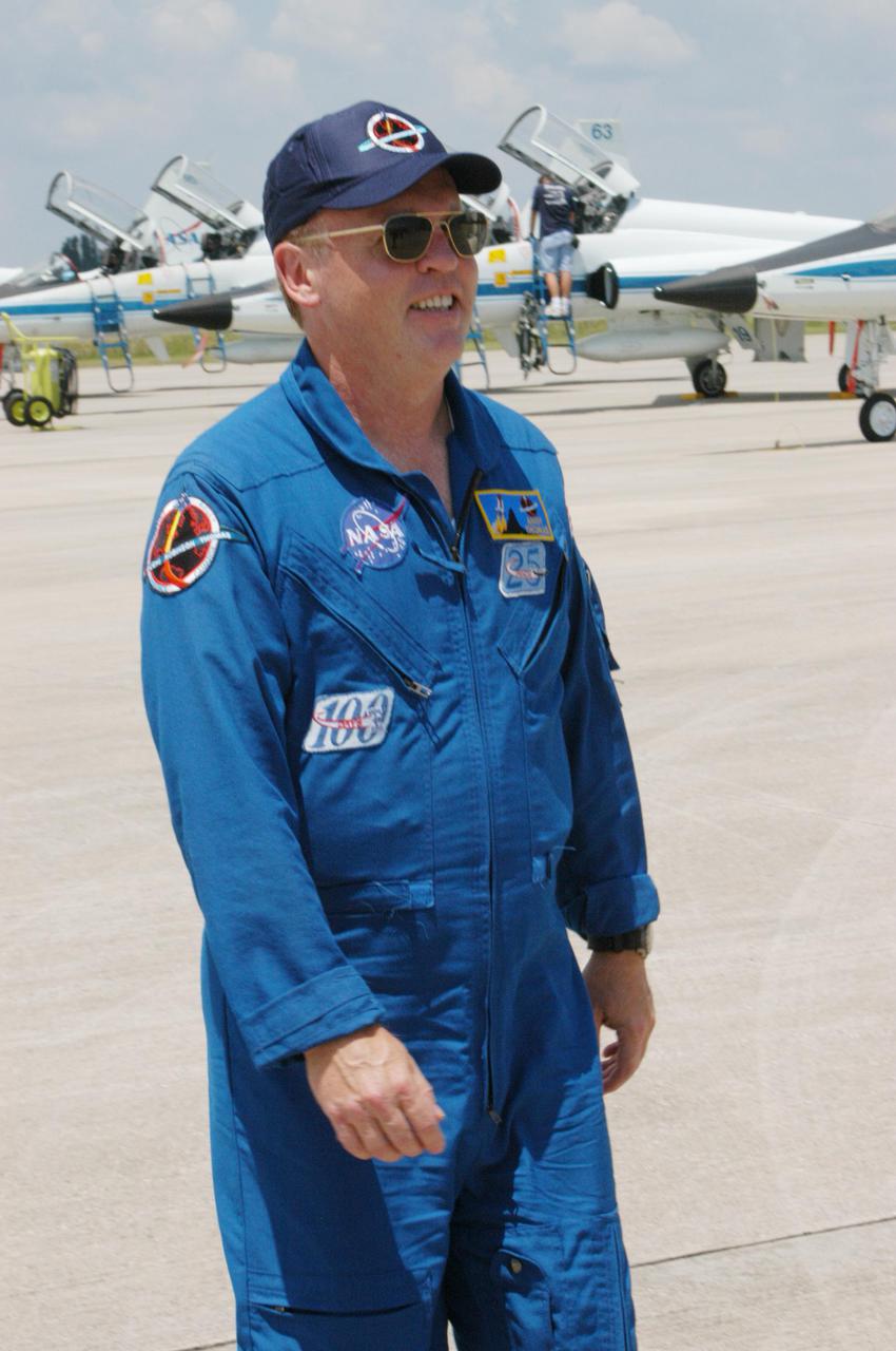 KENNEDY SPACE CENTER, FLA. -   The Return to Flight STS-114 crew arrives at NASA Kennedy Space Center in T-38 training jets to get ready for a second launch attempt aboard Space Shuttle Discovery.  Seen in the photo is Mission Specialist Andrew Thomas. Mission Commander Eileen Collins talked to the media waiting nearby stating that since the scrub on July 13, the crew has focused on the on-orbit part of the mission and training for night landings using the Shuttle Training Aircraft.  She praised the engineers and technicians who have been troubleshooting the elusive sensor problem and thanked them.  STS-114 is scheduled to launch July 26 at 10:39 a.m. EDT from Launch Pad 39B.