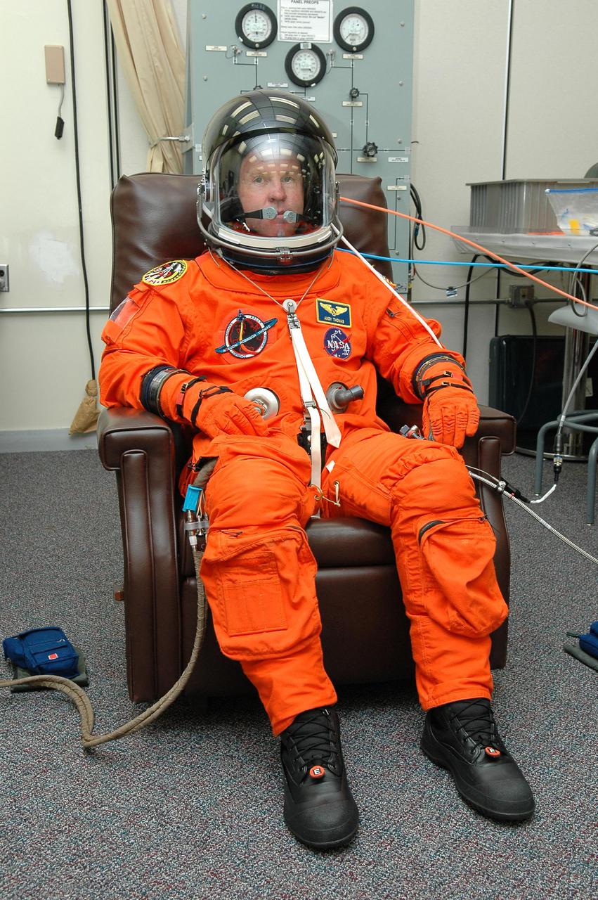 KENNEDY SPACE CENTER, FLA. - In the Operations and Checkout Building at NASA Kennedy Space Center, STS-114 Mission Specialist Andrew Thomas has donned his launch and entry suit before heading to the launch pad. Thomas is making his fourth space flight on the historic Return to Flight mission STS-114 to the International Space Station. On its second attempt for launch, Discovery is scheduled to lift off at 10:39 a.m. EDT today from Launch Pad 39B. It is the 114th Space Shuttle flight and the 31st for Discovery. The 12-day mission is expected to end with touchdown at the Shuttle Landing Facility on Aug. 7.