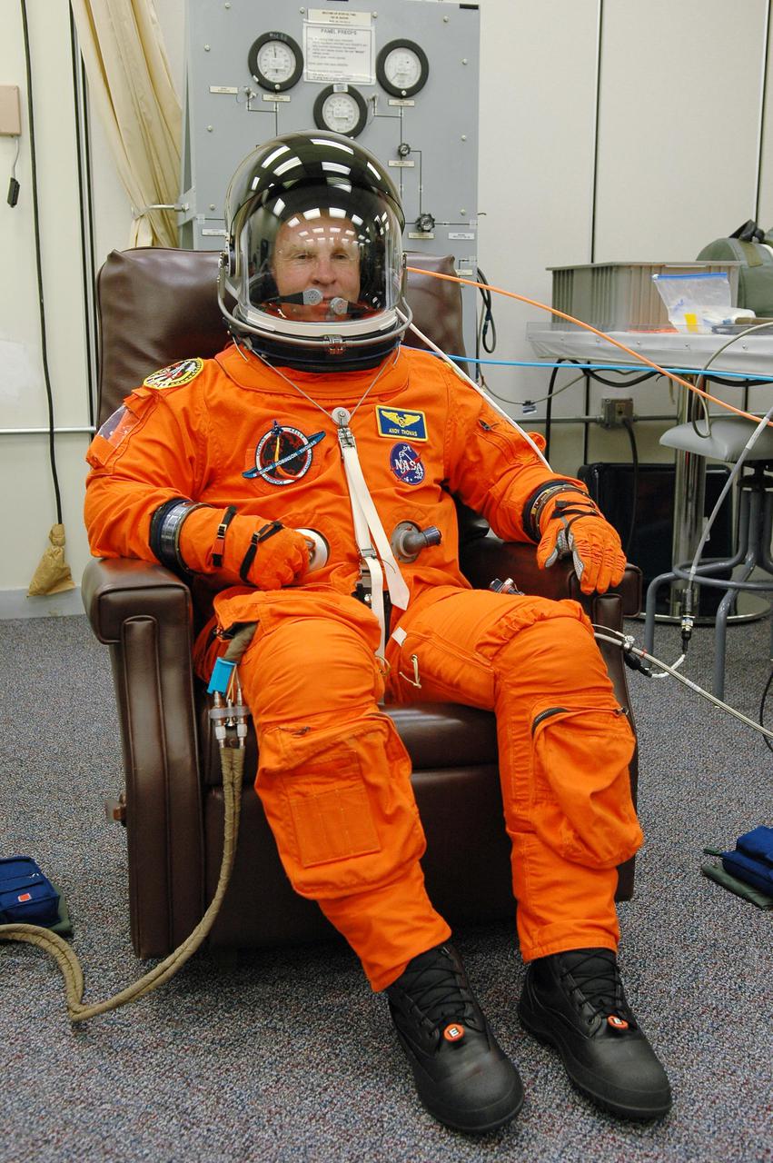 KENNEDY SPACE CENTER, FLA. - In the Operations and Checkout Building at NASA Kennedy Space Center, STS-114 Mission Specialist Andrew Thomas has donned his launch and entry suit before heading to the launch pad. Thomas is making his fourth space flight on the historic Return to Flight mission STS-114 to the International Space Station. On its second attempt for launch, Discovery is scheduled to lift off at 10:39 a.m. EDT today from Launch Pad 39B. It is the 114th Space Shuttle flight and the 31st for Discovery. The 12-day mission is expected to end with touchdown at the Shuttle Landing Facility on Aug. 7.