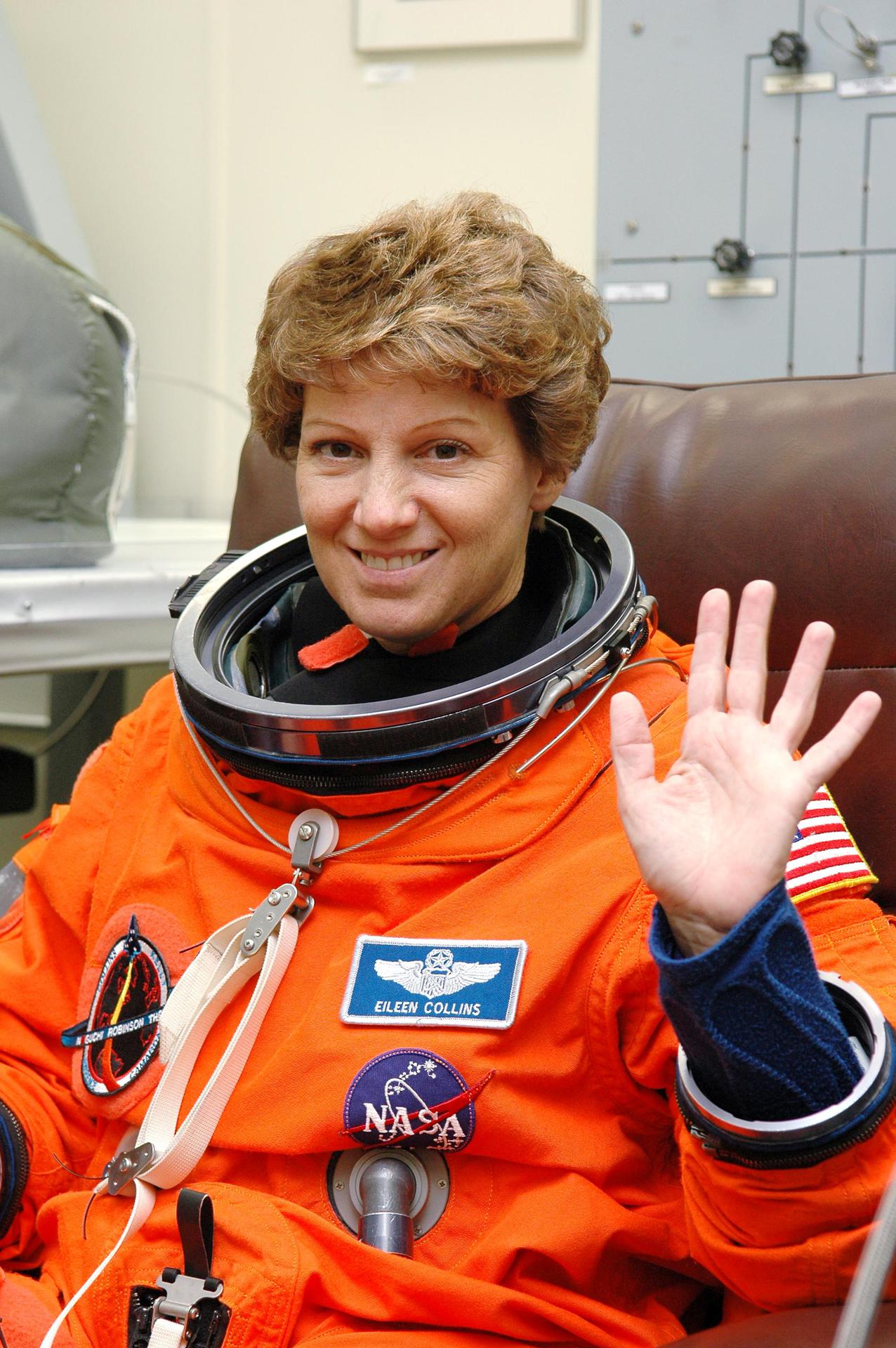 Astronaut Eileen Collins wearing her orange flight suit