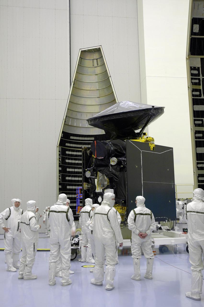 KENNEDY SPACE CENTER, FLA. - In the Payload Hazardous Servicing Facility, the first half of the fairing (left) is ready to be moved closer to the Mars Reconnaissance Orbiter (right) for installation.  The fairing protects the spacecraft during launch and flight through the atmosphere.  Once in space, it is jettisoned.  Launch of the MRO aboard an Atlas V rocket will be from Launch Complex 41 at Cape Canaveral Air Force Station in Florida.  The MRO is the next major step in Mars exploration and scheduled for launch from Cape Canaveral Air Force Station in a window opening Aug. 10. The MRO is an important next step in fulfilling NASA’s vision of space exploration and ultimately sending human explorers to Mars and beyond.