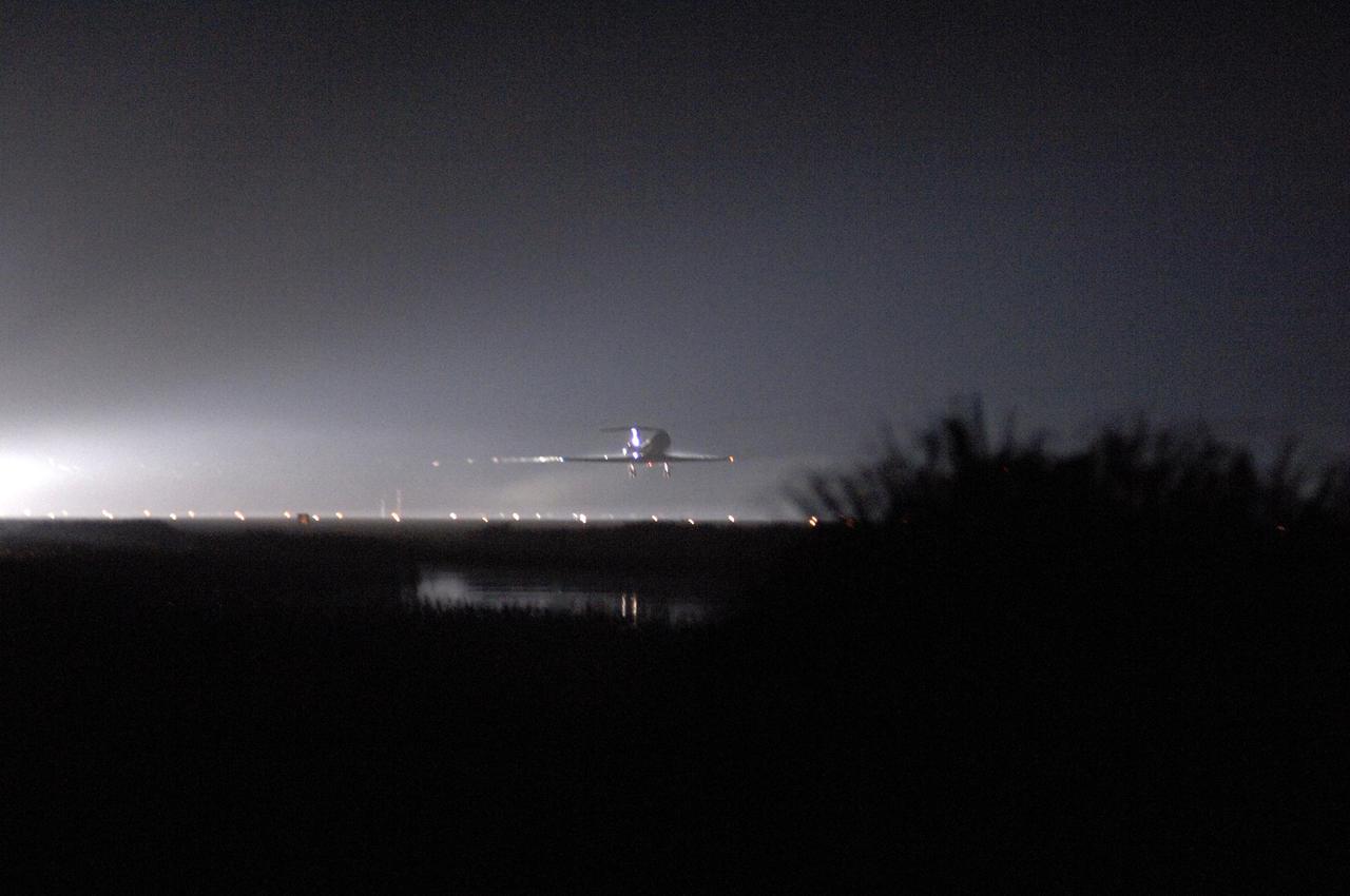KENNEDY SPACE CENTER, FLA. -  In the pre-dawn hours, the Shuttle Training Aircraft (STA) approaches the runway on NASA Kennedy Space Center’s Shuttle Landing Facility.  The STA was in the air to observe flying conditions for the pending landing of Space Shuttle Discovery to conclude Return to Flight mission STS-114.  The landing was postponed until Aug. 9.