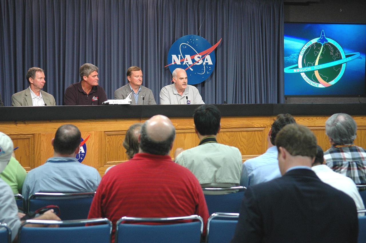 KENNEDY SPACE CENTER, FLA. -  At a post-landing briefing, NASA Administrator Mike Griffin, Space Shuttle Program Manager Bill Parsons, Shuttle Launch Director Mike Leinbach and Associate Administrator of NASA’s Space Operations Mission Directorate Bill Readdy respond to questions from the media. Space Shuttle Discovery safely landed at Edwards Air Force Base in California at 8:11 a.m. EDT, guided by Mission Commander Eileen Collins.  Discovery spent two weeks in space on Return to Flight mission STS-114, where the crew demonstrated new methods to inspect and repair the Shuttle in orbit. The crew also delivered supplies, outfitted and performed maintenance on the International Space Station. A number of these tasks were conducted during three spacewalks.