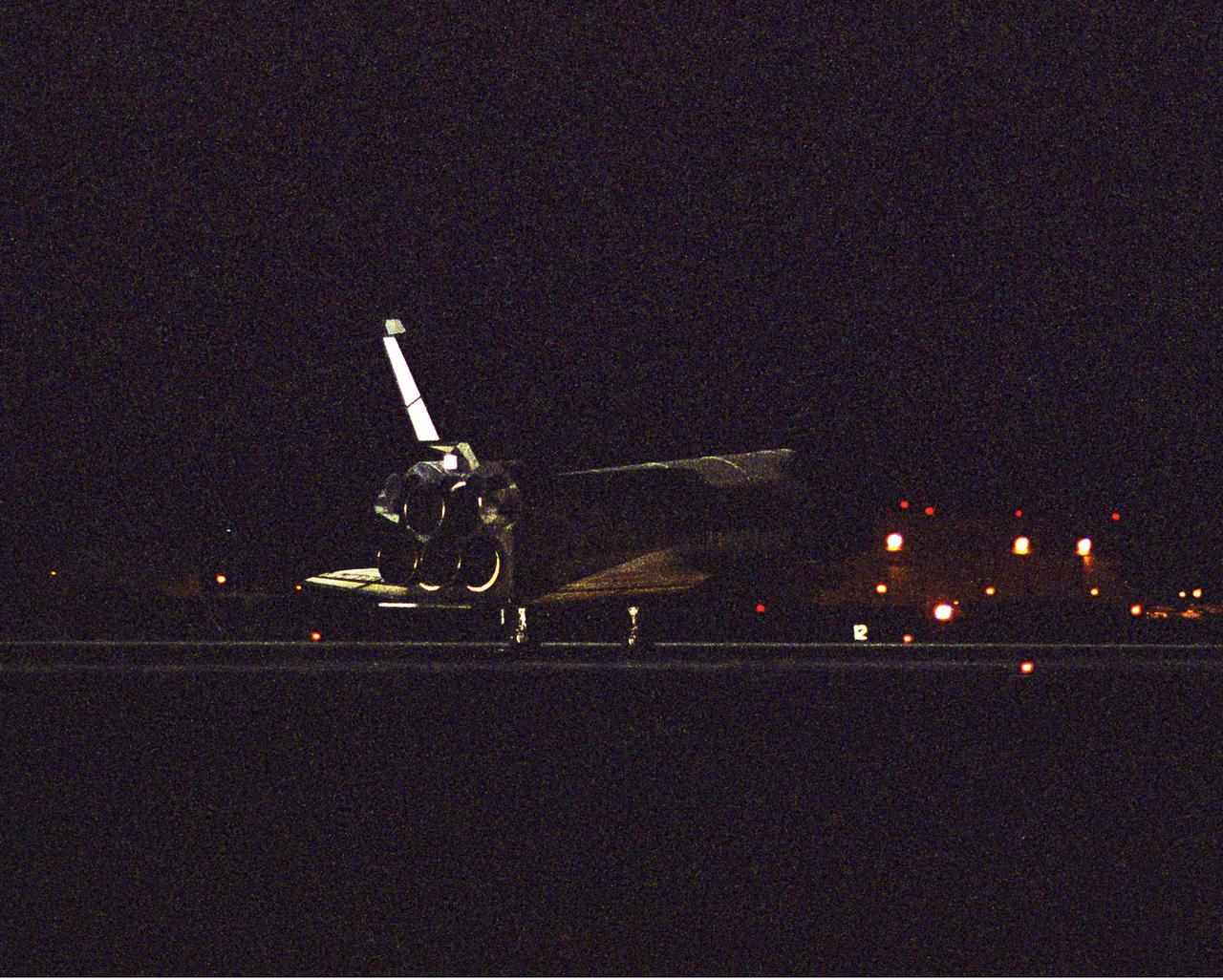 DRYDEN FLIGHT RESEARCH CENTER, CA. - (EC05-0166-04_Dryden) Space Shuttle Discovery comes to a stop after a flawless landing on Runway 22 at Edwards Air Force Base in California.  The landing completes the successful Return to Flight mission STS-114 to the International Space Station.  Landing time was 8:11:22 a.m. EDT.  The landing was deferred from Kennedy Space Center due to weather concerns.  Aboard Discovery was her crew of seven: Mission Commander Eileen Collins, Pilot James Kelly and Mission Specialists Stephen Robinson, Andrew Thomas, Wendy Lawrence, Charles Camarda and Soichi Noguchi, who represents the Japan Aerospace Exploration Agency.  This is the 50th Shuttle landing at Edwards and the sixth night landing.