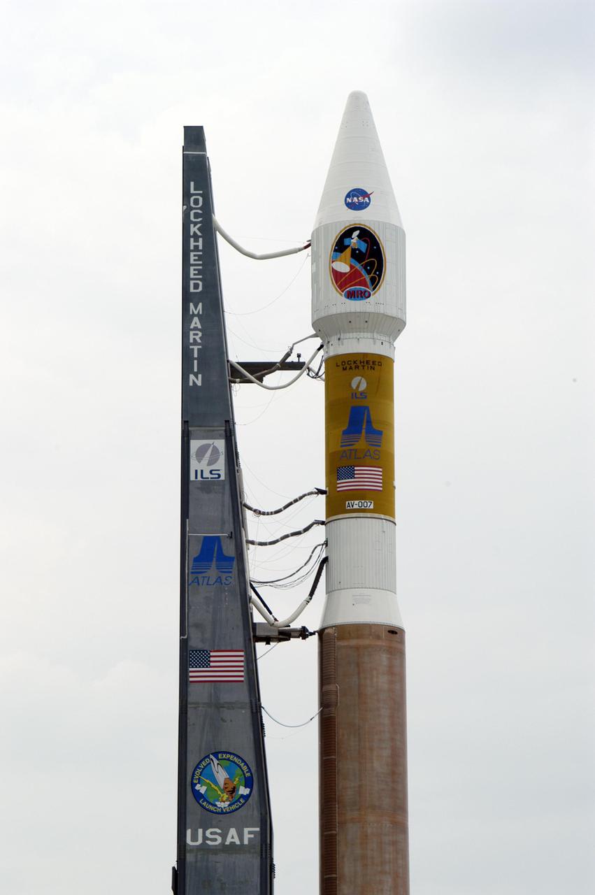 KENNEDY SPACE CENTER, FLA. - NASA's Mars Reconnaissance Orbiter (MRO), atop a Lockheed Martin Atlas V rocket, awaits launch at Launch Complex 41 at Cape Canaveral Air Force Station in Florida. The launch was delayed 24 hours to investigate an anomalous reading in the hydrogen propellant loading system on the Atlas V. At the conclusion of the inquiry, the Atlas V was cleared to launch on Aug. 12 between 7:43 and 9:43 a.m. EDT. The spacecraft will arrive at Mars in March 2006. Once in orbit around Mars, various instruments on the MRO will convey detailed observations of the Martian surface, subsurface and atmosphere. Researchers will use the data to study the history and distribution of Martian water. Learning more about what has happened to the water will focus searches for possible past or present Martian life. Observations by the orbiter will also support future Mars missions by examining potential landing sites and providing a communications relay between the Martian surface and Earth.