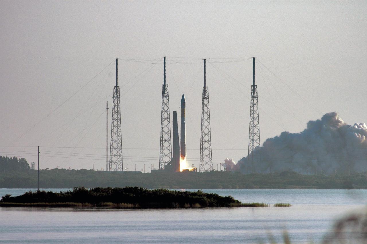 KENNEDY SPACE CENTER, FLA. - NASA's Mars Reconnaissance Orbiter (MRO) launches at 7:43 a.m. EDT atop a Lockheed Martin Atlas V rocket from Launch Complex 41 at Cape Canaveral Air Force Station in Florida on Aug. 12. All systems performed nominally for NASA's first Atlas V launch. The spacecraft will arrive at Mars in March 2006. Once in orbit around Mars, various instruments on the MRO will convey detailed observations of the Martian surface, subsurface and atmosphere. Researchers will use the data to study the history and distribution of Martian water. Learning more about what has happened to the water will focus searches for possible past or present Martian life. Observations by the orbiter will also support future Mars missions by examining potential landing sites and providing a communications relay between the Martian surface and Earth.
