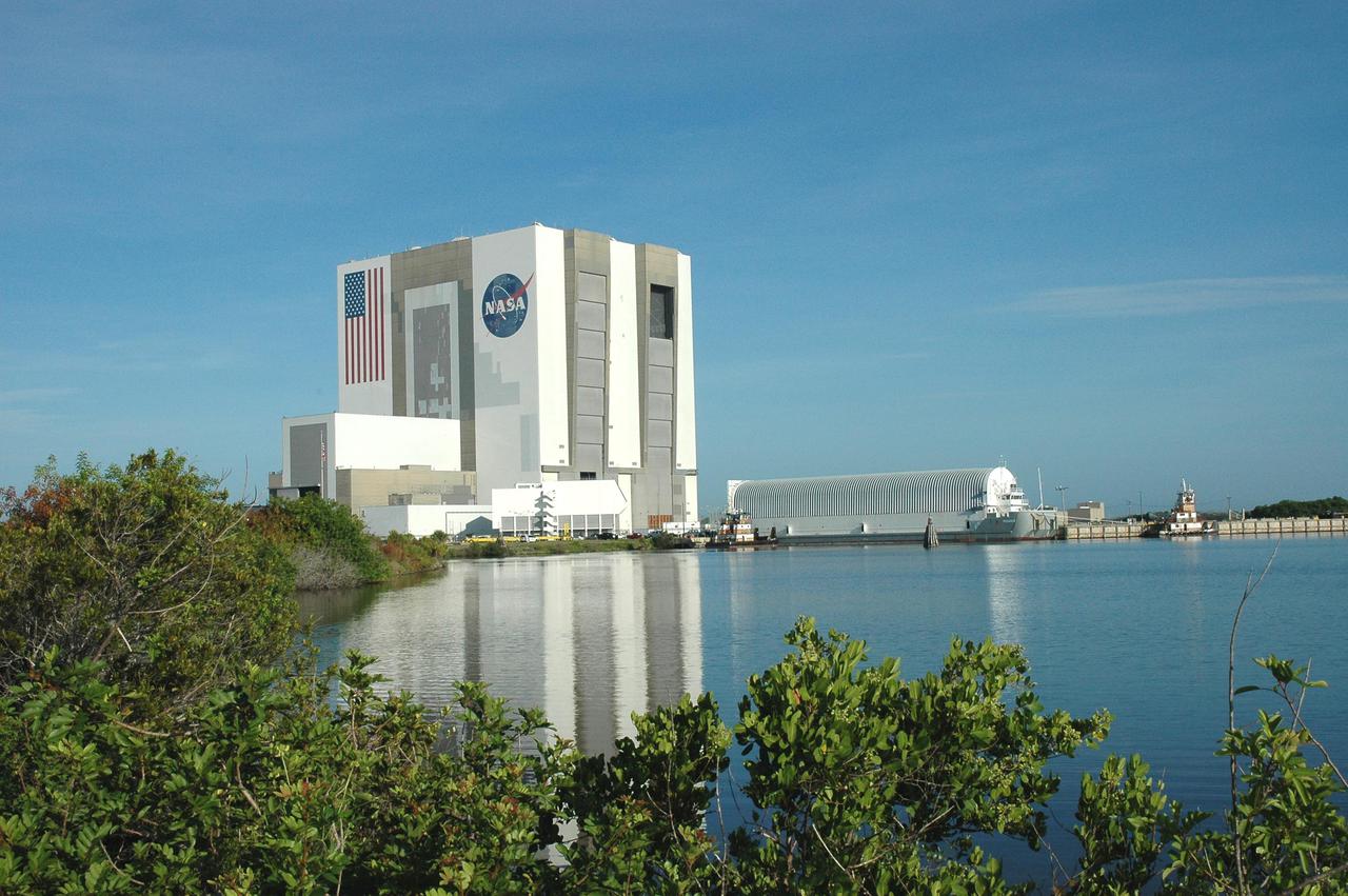 KENNEDY SPACE CENTER, FLA. - Viewed across the Turn Basin at NASA Kennedy Space Center, the barge Pegasus is ready for towing to Port Canaveral where it will join one of the Solid Rocket Booster Recovery Ships and begin its journey around the Florida peninsula to Michoud Assembly Facility in New Orleans. The barge’s cargo is External Tank 119. Delivered to KSC in June, ET-119 is the third newly redesigned tank.
