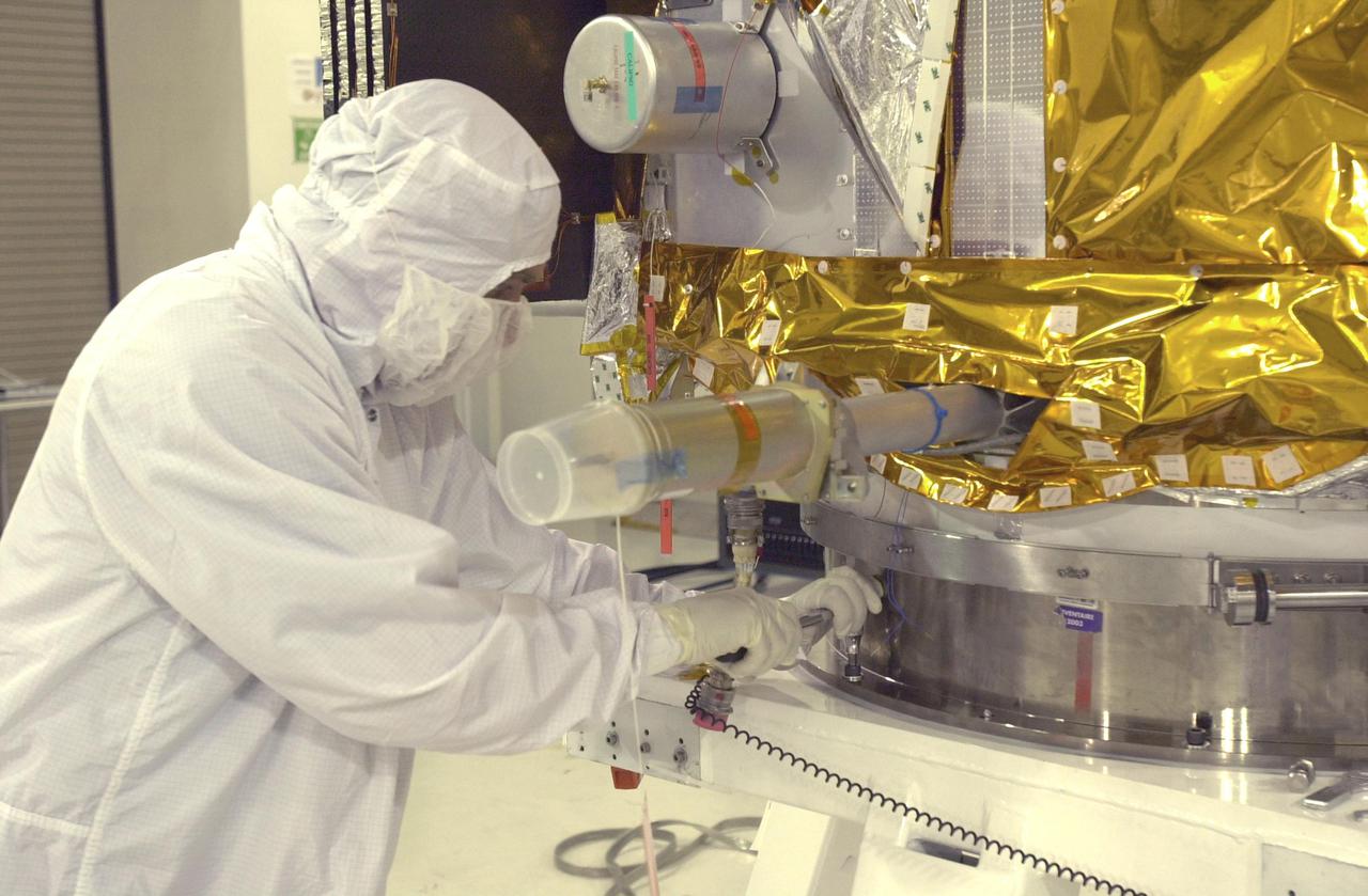 VANDENBERG AIR FORCE BASE, CALIF. - At Vandenberg Air Force Base in California, a worker prepares the CALIPSO spacecraft for a move to a specially modified container where LIDAR (LIght Detection And Ranging) laser testing will take place. CALIPSO stands for Cloud-Aerosol LIDAR and Infrared Pathfinder Satellite Observation. LIDAR measures distance, speed, rotation, chemical composition and concentration. CALIPSO and CloudSat will fly in formation with three other satellites in the A-train constellation to enhance understanding of our climate system. They are highly complementary satellites and together they will provide never-before-seen 3-D perspectives of how clouds and aerosols form, evolve, and affect weather and climate. Launch of CALIPSO_CloudSat aboard a Boeing Delta II rocket is scheduled for 3:01 a.m. PDT Sept. 29.