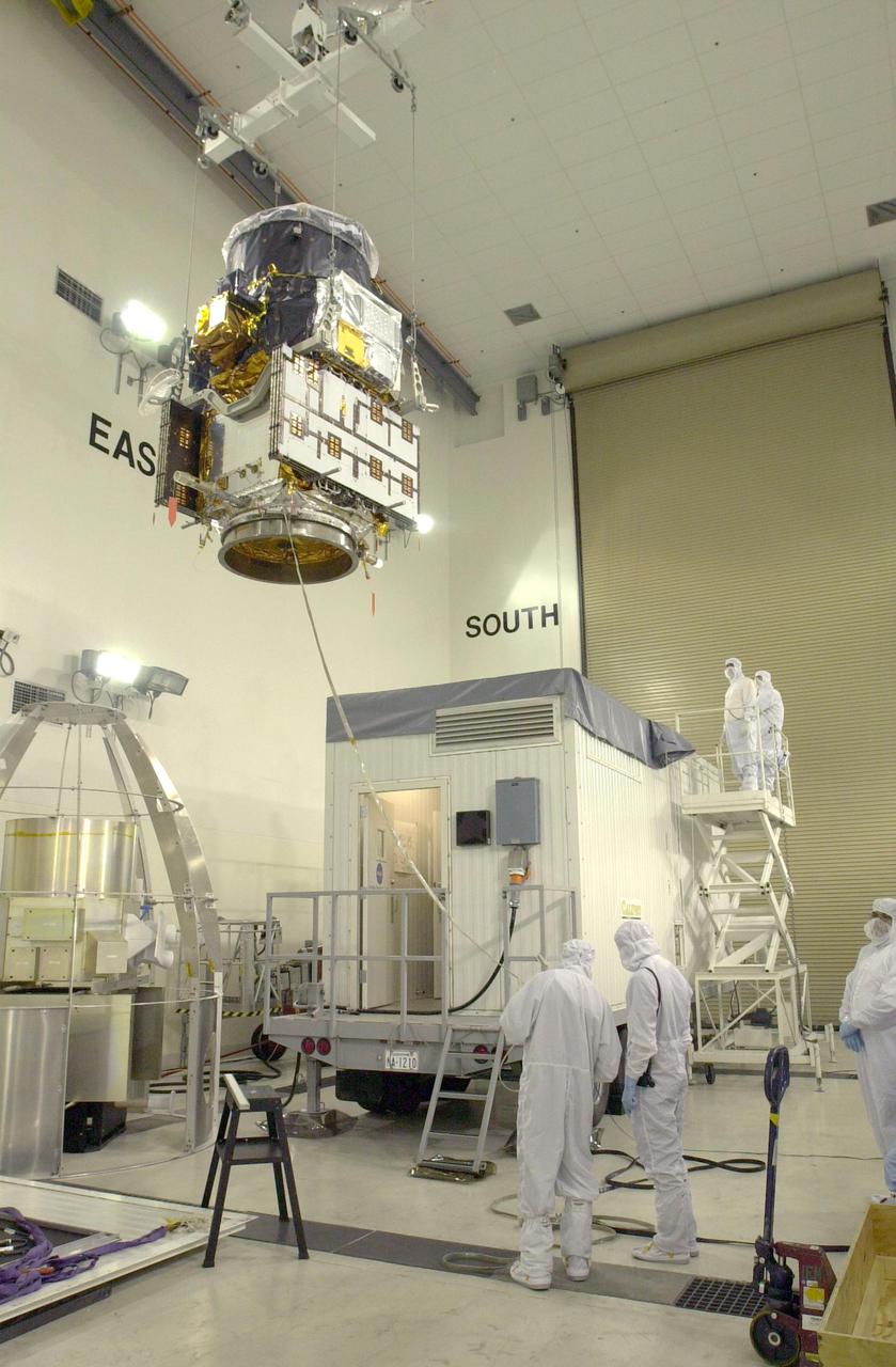 VANDENBERG AIR FORCE BASE, CALIF. - At Vandenberg Air Force Base in California, the suspended CALIPSO spacecraft is moved toward a specially modified container (lower right) where LIDAR (LIght Detection And Ranging) laser testing will take place. CALIPSO stands for Cloud-Aerosol LIDAR and Infrared Pathfinder Satellite Observation. LIDAR measures distance, speed, rotation, chemical composition and concentration. CALIPSO and CloudSat will fly in formation with three other satellites in the A-train constellation to enhance understanding of our climate system. They are highly complementary satellites and together they will provide never-before-seen 3-D perspectives of how clouds and aerosols form, evolve, and affect weather and climate. Launch of CALIPSO_CloudSat aboard a Boeing Delta II rocket is scheduled for 3:01 a.m. PDT Sept. 29.
