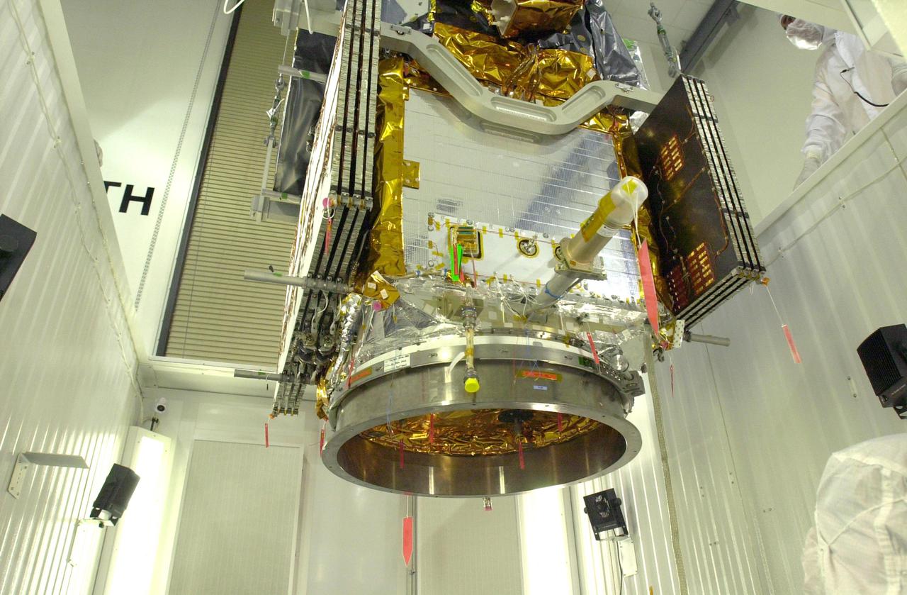 VANDENBERG AIR FORCE BASE, CALIF.   - At Vandenberg Air Force Base in California, the suspended CALIPSO spacecraft is lowered inside a specially modified container where LIDAR (LIght Detection And Ranging) laser testing will take place. CALIPSO stands for Cloud-Aerosol LIDAR and Infrared Pathfinder Satellite Observation.   LIDAR measures distance, speed, rotation, chemical composition and concentration. CALIPSO and CloudSat will fly in formation with three other satellites in the A-train constellation to enhance understanding of our climate system. They are highly complementary satellites and together they will provide never-before-seen 3-D perspectives of how clouds and aerosols form, evolve, and affect weather and climate. Launch of CALIPSO_CloudSat aboard a Boeing Delta II rocket is scheduled for 3:01 a.m. PDT Sept. 29.