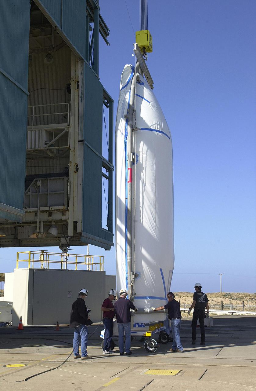 VANDENBERG AIR FORCE BASE, CALIF.  - At NASA Space Launch Complex 2 on Vandenberg Air Force Base in California, one half of the fairing for CALIPSO_CloudSat is ready to be lifted into the mobile service tower, or gantry.  The fairing encloses and protects the spacecraft during launch and flight through the atmosphere. Once in space, it is jettisoned. CALIPSO stands for Cloud-Aerosol Lidar and Infrared Pathfinder Satellite Observation.   CALIPSO and CloudSat are highly complementary satellites and together will provide never-before-seen 3-D perspectives of how clouds and aerosols form, evolve, and affect weather and climate. CALIPSO and CloudSat will fly in formation with three other satellites in the A-train constellation to enhance understanding of our climate system. Launch of CALIPSO_CloudSat aboard a Boeing Delta II rocket is scheduled for 3:01 a.m. Sept. 29.