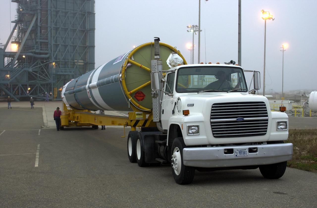 VANDENBERG AIR FORCE BASE, CALIF.  -  At NASA Space Launch Complex 2 on Vandenberg Air Force Base in California, the first stage of the Boeing Delta II rocket for the CALIPSO_CloudSat launch arrives on the pad.  It will be raised to vertical and lifted up into the mobile service tower, or gantry. CALIPSO stands for Cloud-Aerosol Lidar and Infrared Pathfinder Satellite Observation.   CALIPSO and CloudSat are highly complementary satellites and together will provide never-before-seen 3-D perspectives of how clouds and aerosols form, evolve, and affect weather and climate. CALIPSO and CloudSat will fly in formation with three other satellites in the A-train constellation to enhance understanding of our climate system. Launch of CALIPSO_CloudSat aboard a Boeing Delta II rocket is scheduled for 3:01 a.m. Sept. 29.