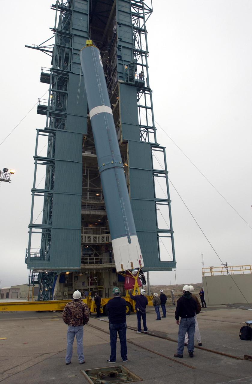 VANDENBERG AIR FORCE BASE, CALIF.   -  At NASA Space Launch Complex 2 on Vandenberg Air Force Base in California, the Boeing Delta II rocket, launch vehicle for the CALIPSO_CloudSat spacecraft, is being raised to a vertical position.  Once it is vertical, it will be lifted up into the mobile service tower, or gantry. CALIPSO stands for Cloud-Aerosol Lidar and Infrared Pathfinder Satellite Observation.  CALIPSO and CloudSat are highly complementary satellites and together will provide never-before-seen 3-D perspectives of how clouds and aerosols form, evolve, and affect weather and climate. CALIPSO and CloudSat will fly in formation with three other satellites in the A-train constellation to enhance understanding of our climate system. Launch of CALIPSO_CloudSat aboard a Boeing Delta II rocket is scheduled for 3:01 a.m. Sept. 29.