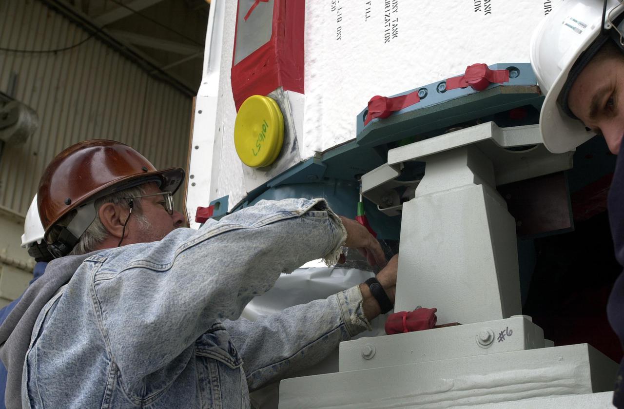 VANDENBERG AIR FORCE BASE, CALIF.  - At NASA Space Launch Complex 2 on Vandenberg Air Force Base in California, the Boeing Delta II rocket, launch vehicle for the CALIPSO_CloudSat spacecraft, is prepared for lifting into the mobile service tower, or gantry. CALIPSO stands for Cloud-Aerosol Lidar and Infrared Pathfinder Satellite Observation.  CALIPSO and CloudSat are highly complementary satellites and together will provide never-before-seen 3-D perspectives of how clouds and aerosols form, evolve, and affect weather and climate. CALIPSO and CloudSat will fly in formation with three other satellites in the A-train constellation to enhance understanding of our climate system. Launch of CALIPSO_CloudSat aboard a Boeing Delta II rocket is scheduled for 3:01 a.m. Sept. 29.
