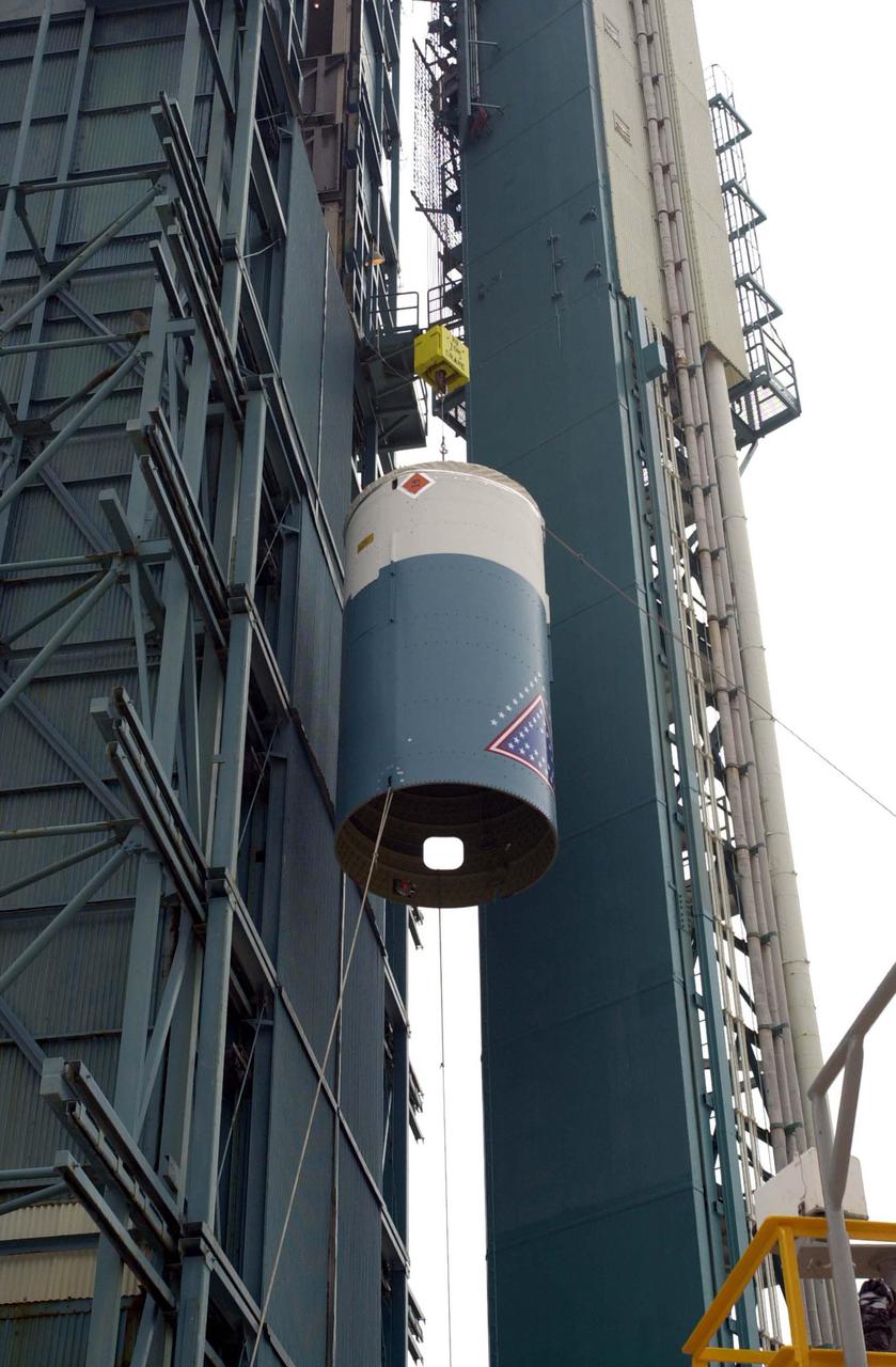 VANDENBERG AIR FORCE BASE, CALIF.  - At NASA Space Launch Complex 2 on Vandenberg Air Force Base in California, the interstage for the Boeing Delta II rocket is lifted up the mobile service tower, or gantry.  There it will be mated with the first stage already there.  The Delta is the launch vehicle for the CALIPSO_CloudSat spacecraft.  CALIPSO stands for Cloud-Aerosol Lidar and Infrared Pathfinder Satellite Observation.  CALIPSO and CloudSat are highly complementary satellites and together will provide never-before-seen 3-D perspectives of how clouds and aerosols form, evolve, and affect weather and climate. CALIPSO and CloudSat will fly in formation with three other satellites in the A-train constellation to enhance understanding of our climate system. Launch of CALIPSO_CloudSat aboard a Boeing Delta II rocket is scheduled for 3:01 a.m. Sept. 29.