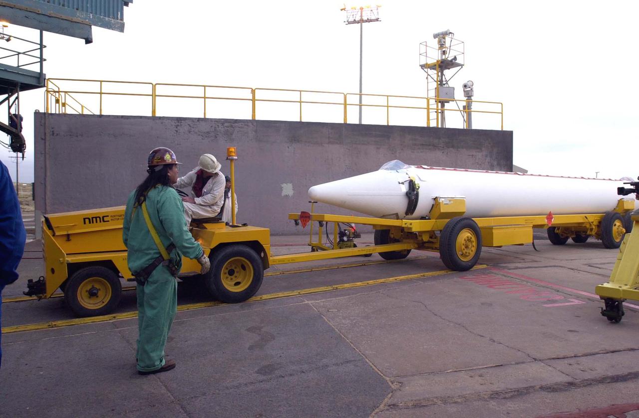 VANDENBERG AIR FORCE BASE, CALIF.  -  The first Solid Rocket Booster for the CALIPSO_CloudSat launch arrives at NASA Space Launch Complex 2 on Vandenberg Air Force Base in California.  It will be lifted into the mobile service tower, or gantry, and attached to the Boeing Delta II rocket.  CALIPSO stands for Cloud-Aerosol Lidar and Infrared Pathfinder Satellite Observation.  CALIPSO and CloudSat are highly complementary satellites and together will provide never-before-seen 3-D perspectives of how clouds and aerosols form, evolve, and affect weather and climate. CALIPSO and CloudSat will fly in formation with three other satellites in the A-train constellation to enhance understanding of our climate system. Launch of CALIPSO_CloudSat aboard a Boeing Delta II rocket is scheduled for 3:01 a.m. Sept. 29.