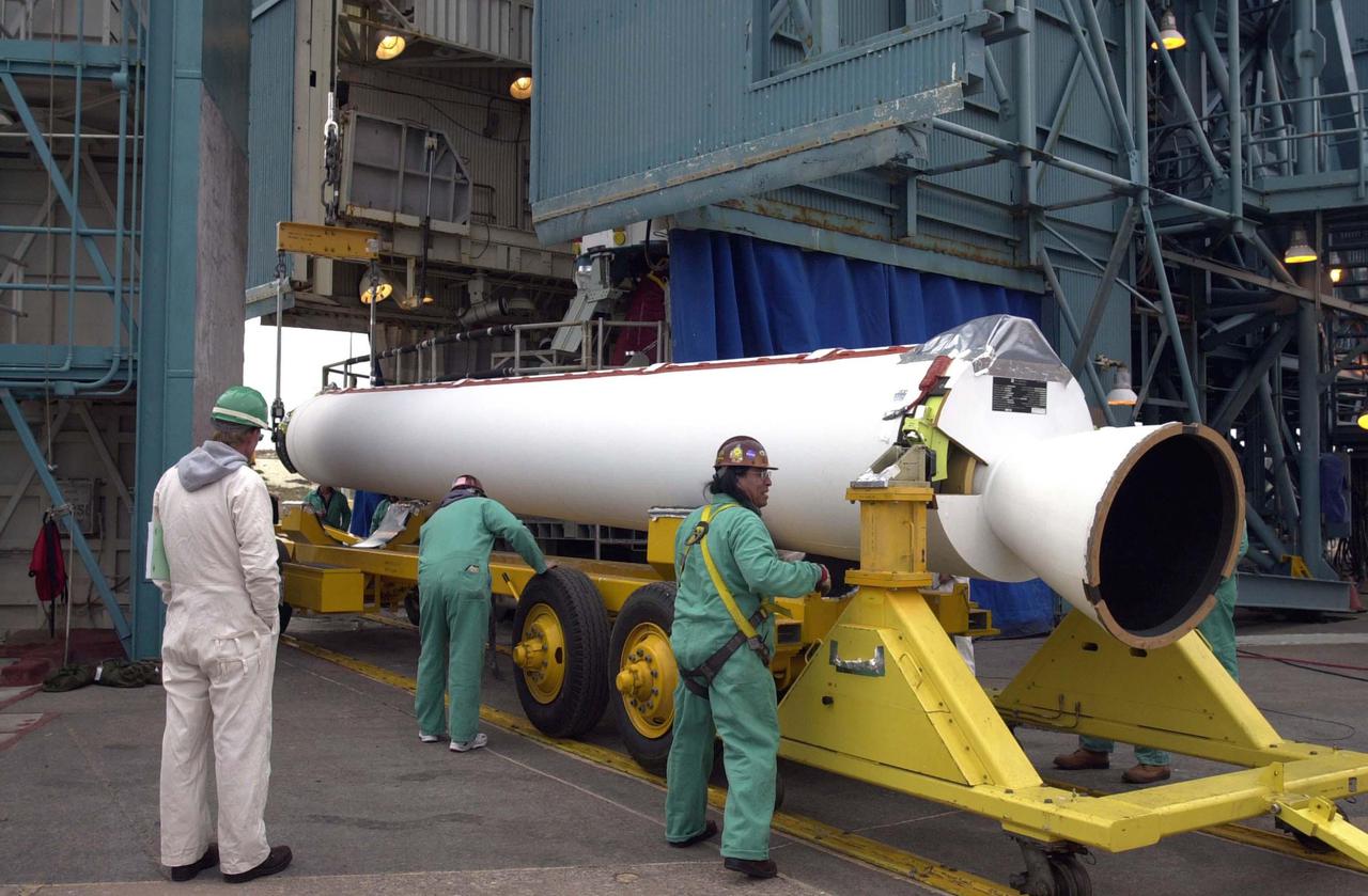 VANDENBERG AIR FORCE BASE, CALIF.  - One of four Solid Rocket Boosters for the CALIPSO_CloudSat launch arrives at NASA Space Launch Complex 2 on Vandenberg Air Force Base in California.  It will be lifted into the mobile service tower, or gantry, and attached to the Boeing Delta II rocket.  CALIPSO stands for Cloud-Aerosol Lidar and Infrared Pathfinder Satellite Observation.  CALIPSO and CloudSat are highly complementary satellites and together will provide never-before-seen 3-D perspectives of how clouds and aerosols form, evolve, and affect weather and climate. CALIPSO and CloudSat will fly in formation with three other satellites in the A-train constellation to enhance understanding of our climate system. Launch of CALIPSO_CloudSat aboard a Boeing Delta II rocket is scheduled for 3:01 a.m. Sept. 29.
