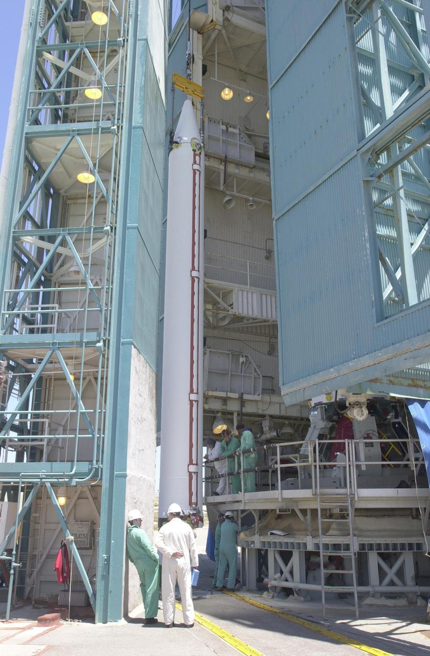 VANDENBERG AIR FORCE BASE, CALIF.  - At NASA Space Launch Complex 2 on Vandenberg Air Force Base in California, another Solid Rocket Booster is attached to the Boeing Delta II rocket seen behind it.  The Delta is the launch vehicle for the CALIPSO_CloudSat spacecraft. CALIPSO stands for Cloud-Aerosol Lidar and Infrared Pathfinder Satellite Observation.  CALIPSO and CloudSat are highly complementary satellites and together will provide never-before-seen 3-D perspectives of how clouds and aerosols form, evolve, and affect weather and climate. CALIPSO and CloudSat will fly in formation with three other satellites in the A-train constellation to enhance understanding of our climate system. Launch of CALIPSO_CloudSat aboard a Boeing Delta II rocket is scheduled for 3:01 a.m. Sept. 29.