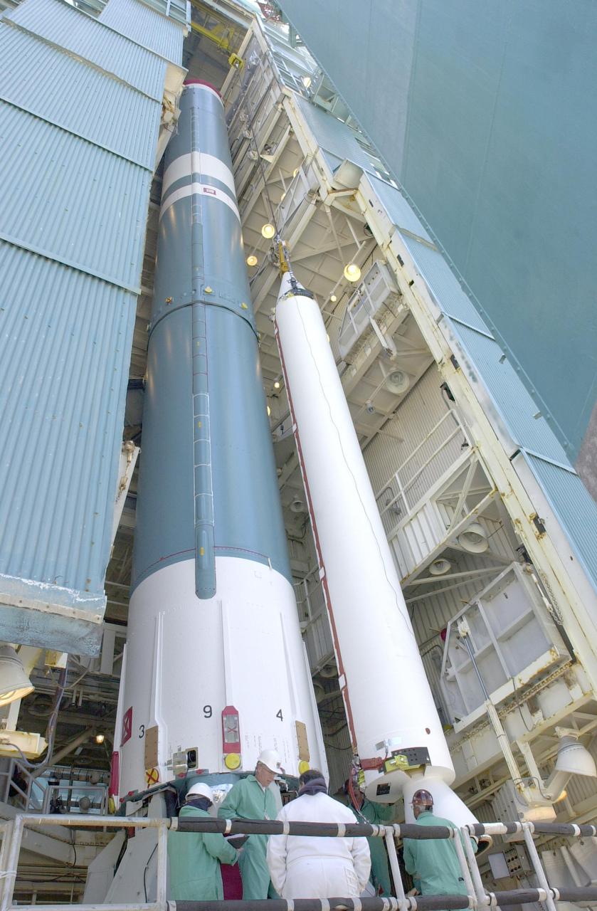VANDENBERG AIR FORCE BASE, CALIF.  - At NASA Space Launch Complex 2 on Vandenberg Air Force Base in California, another Solid Rocket Booster is attached to the Boeing Delta II rocket seen behind it.  The Delta is the launch vehicle for the CALIPSO_CloudSat spacecraft. CALIPSO stands for Cloud-Aerosol Lidar and Infrared Pathfinder Satellite Observation.  CALIPSO and CloudSat are highly complementary satellites and together will provide never-before-seen 3-D perspectives of how clouds and aerosols form, evolve, and affect weather and climate. CALIPSO and CloudSat will fly in formation with three other satellites in the A-train constellation to enhance understanding of our climate system. Launch of CALIPSO_CloudSat aboard a Boeing Delta II rocket is scheduled for 3:01 a.m. Sept. 29.
