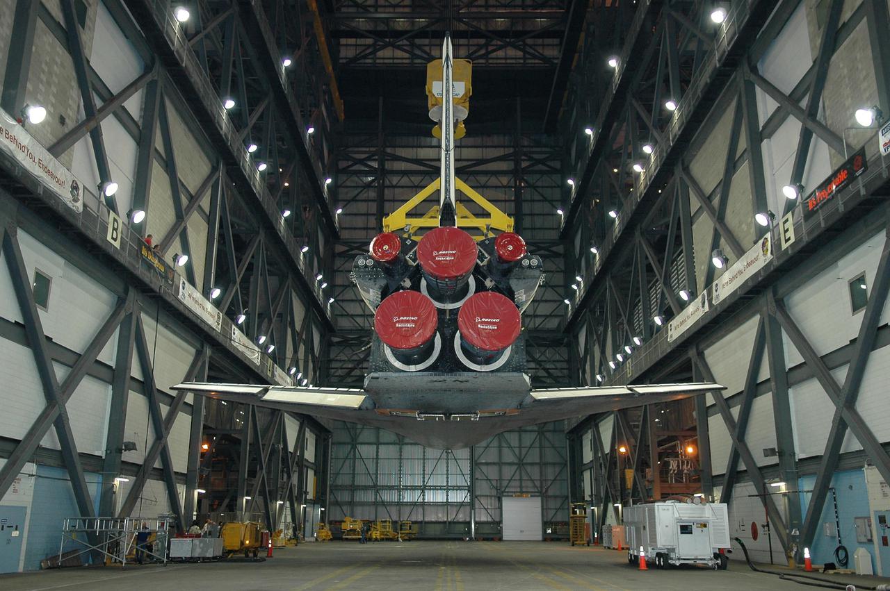 KENNEDY SPACE CENTER, FLA.  - In the Vehicle Assembly Building (VAB), Space Shuttle Atlantis is positioned horizontally as it is lowered into the transfer aisle.  The vehicle was just demated from its External Tank_Solid Rocket Booster stack in one of the VAB's high bays. The orbiter will be rolled back to Orbiter Processing Facility bay 1 where processing will begin for mission STS-115, the 19th flight to the International Space Station. The tank, ET-120, is the first redesigned ET to arrive at KSC and will undergo further testing before Return to Flight mission STS-121 next year.