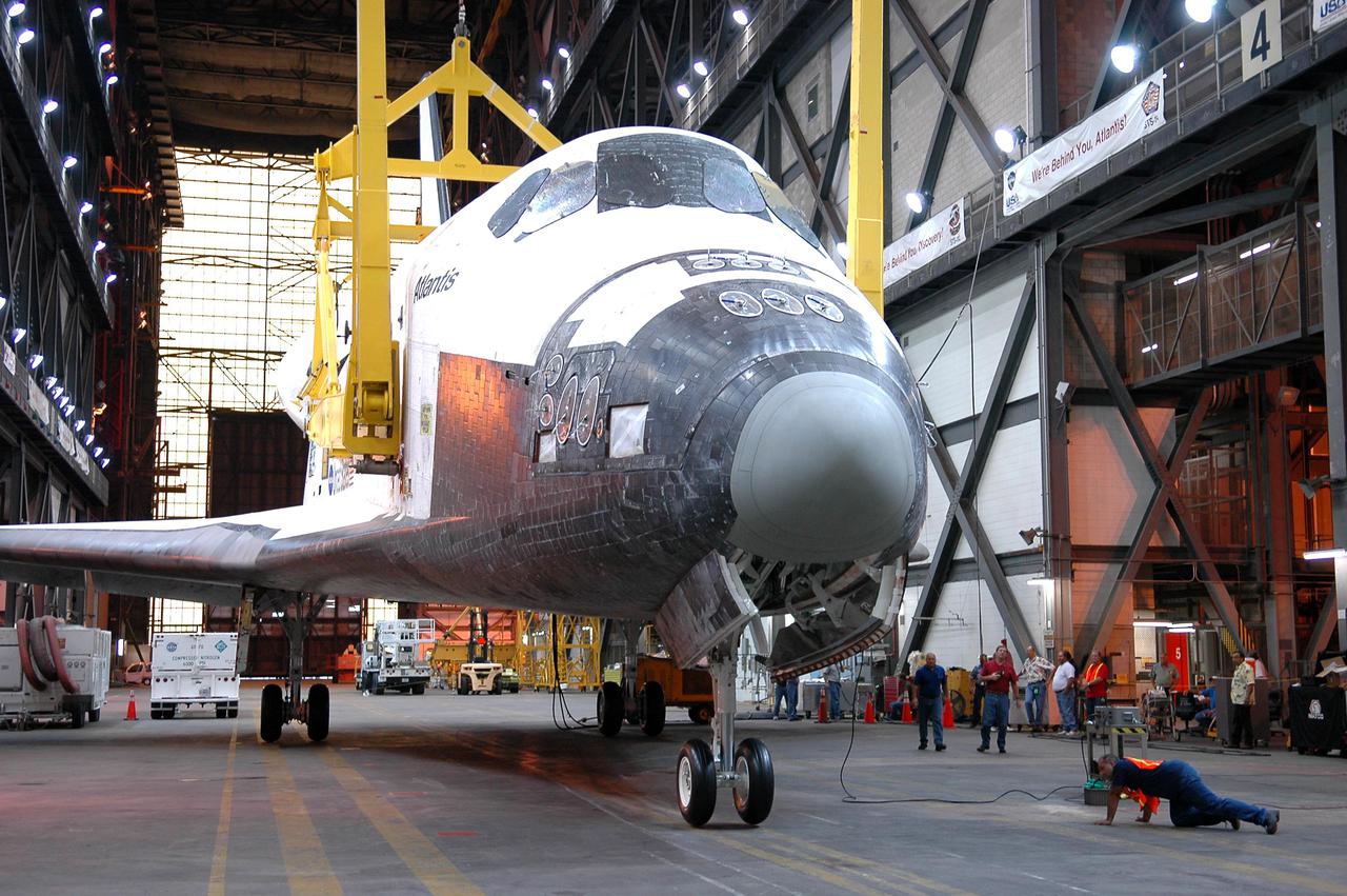 KENNEDY SPACE CENTER, FLA.  - In the Vehicle Assembly Building (VAB), Space Shuttle Atlantis rests on its landing gear on the floor of the transfer aisle.  The vehicle was just demated from its External Tank_Solid Rocket Booster stack in one of the VAB's high bays. The orbiter will be rolled back to Orbiter Processing Facility bay 1 where processing will begin for mission STS-115, the 19th flight to the International Space Station. The tank, ET-120, is the first redesigned ET to arrive at KSC and will undergo further testing before Return to Flight mission STS-121 next year.
