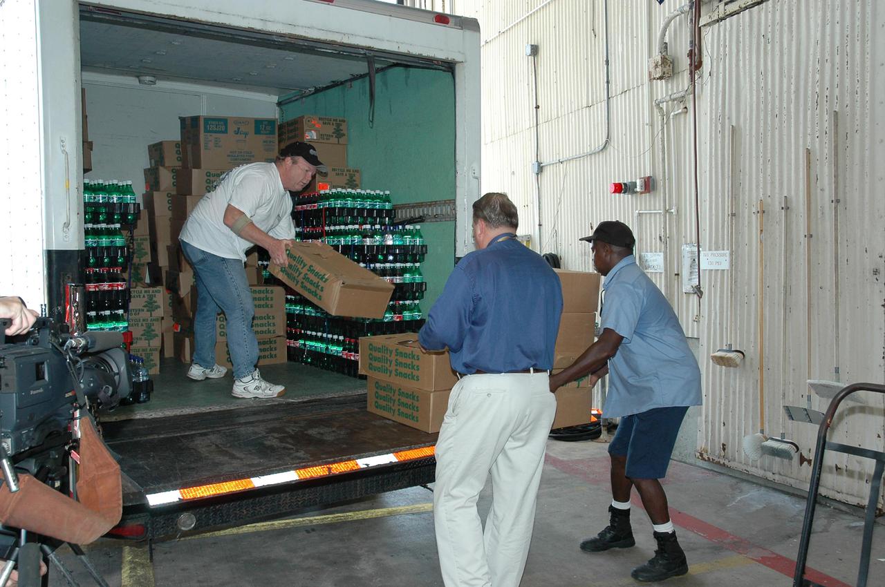 KENNEDY SPACE CENTER, FLA. - Workers at Kennedy Space Center load a truck with supplies heading to Stennis Space Center in Mississippi for NASA workers there. Both Michoud Assembly Facility near New Orleans and Stennis were effected by Hurricane Katrina. KSC is sending a helicopter with medical supplies and an Emergency Medical Technician to Stennis. A NASA plane is carrying medical supplies, food and chain saws, as well as a physician and two high voltage technicians to Michoud to ensure the facility can safely receive power when the main electricity grid comes online. KSC has sent a truck with 1,000 gallons of diesel fuel and three large generators: a 1-megawatt generator, and 125- and 225-kilowatt generators. A 14-person security team is also going to Michoud to relieve the security professionals at that location.