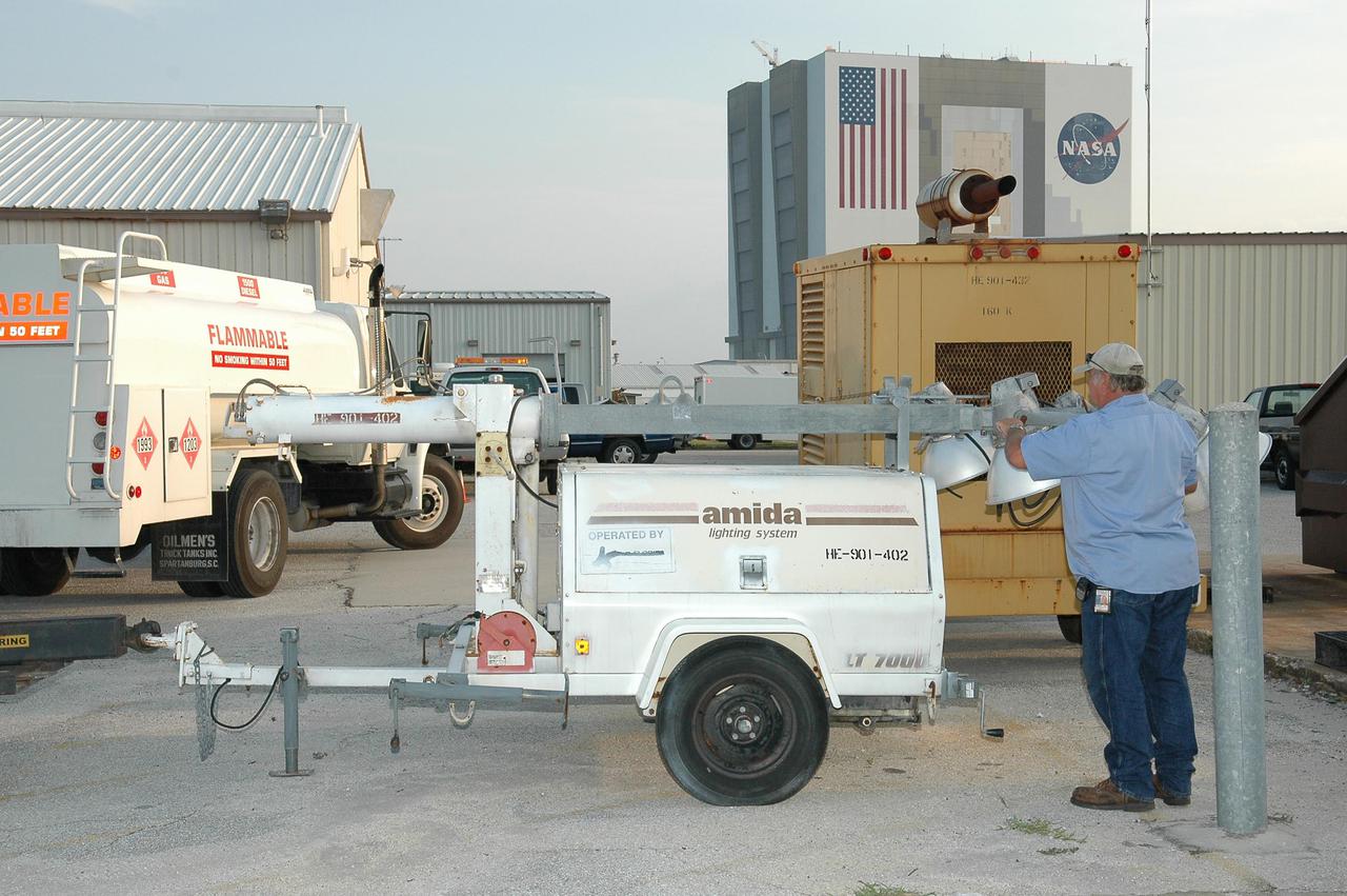 KENNEDY SPACE CENTER, FLA.  - Workers at Kennedy Space Center prepare lighting systems that are being shipped to Michoud Assembly Facility near New Orleans.  Michoud was left without power following Hurricane Katrina.  A NASA plane is carrying medical supplies, food and chain saws, as well as a physician and two high voltage technicians to Michoud to ensure the facility can safely receive power when the main electricity grid comes online.  In addition, a 14-person security team is also going to Michoud to relieve the security professionals at that location. Stennis Space Center also suffered damage and power outages from Hurricane Katrina.   KSC is sending a helicopter with medical supplies and an Emergency Medical Technician to Stennis, plus a 1-megawatt generator and 125- and 225-kilowatt generators, and 1,000 gallons of diesel fuel.
