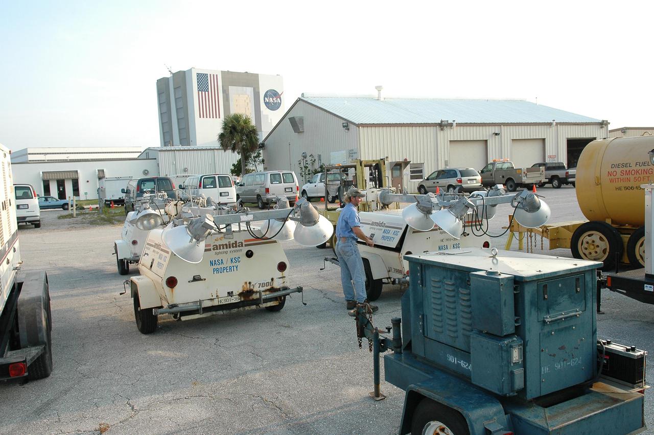 KENNEDY SPACE CENTER, FLA.  - Workers at Kennedy Space Center prepare lighting systems that are being shipped to Michoud Assembly Facility near New Orleans.  Michoud was left without power following Hurricane Katrina.  A NASA plane is carrying medical supplies, food and chain saws, as well as a physician and two high voltage technicians to Michoud to ensure the facility can safely receive power when the main electricity grid comes online.  In addition, a 14-person security team is also going to Michoud to relieve the security professionals at that location. Stennis Space Center also suffered damage and power outages from Hurricane Katrina.   KSC is sending a helicopter with medical supplies and an Emergency Medical Technician to Stennis, plus a 1-megawatt generator and 125- and 225-kilowatt generators, and 1,000 gallons of diesel fuel.