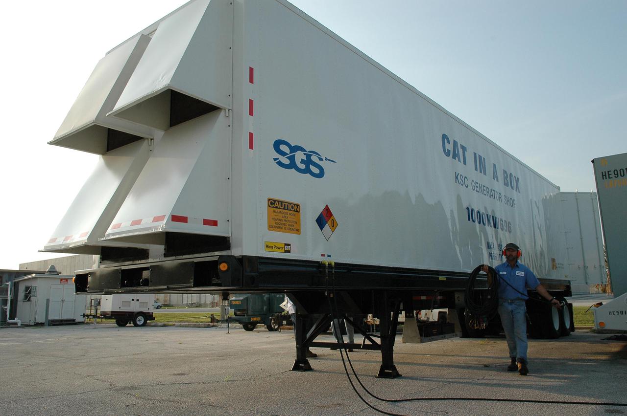 KENNEDY SPACE CENTER, FLA.  - A truck with a 1-megawatt generator is prepared for a trip to Stennis Space Center in Mississippi.  Michoud was left without power following Hurricane Katrina.  A NASA plane is carrying medical supplies, food and chain saws, as well as a physician and two high voltage technicians to Michoud to ensure the facility can safely receive power when the main electricity grid comes online.  In addition, a 14-person security team is also going to Michoud to relieve the security professionals at that location. Stennis Space Center also suffered damage and power outages from Hurricane Katrina.   KSC is sending a helicopter with medical supplies and an Emergency Medical Technician to Stennis, plus a 1-megawatt generator, 125- and 225-kilowatt generators, and 1,000 gallons of diesel fuel.