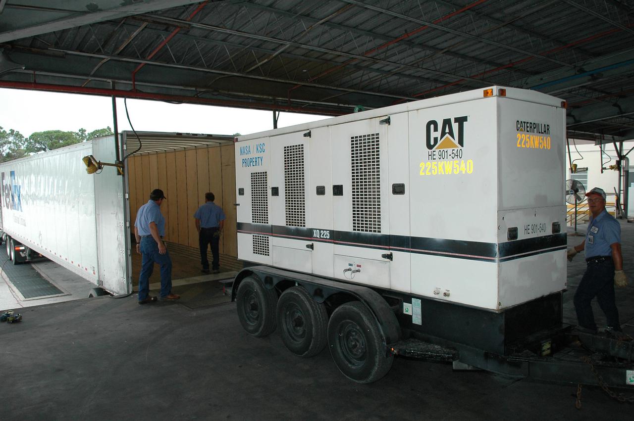 KENNEDY SPACE CENTER, FLA.  - A generator, one of three, is ready to be loaded onto a Federal Express truck for a trip to Stennis Space Center in Mississippi.   Stennis suffered damage and power outages from Hurricane Katrina.   KSC is sending a helicopter with medical supplies and an Emergency Medical Technician to Stennis, plus a 1-megawatt generator, 125- and 225-kilowatt generators, and 1,000 gallons of diesel fuel.  Michoud Assembly Facility near New Orleans was also left without power .  A NASA plane is carrying medical supplies, food and chain saws, as well as a physician and two high voltage technicians to Michoud to ensure the facility can safely receive power when the main electricity grid comes online.  In addition, a 14-person security team is also going to Michoud to relieve the security professionals at that location.