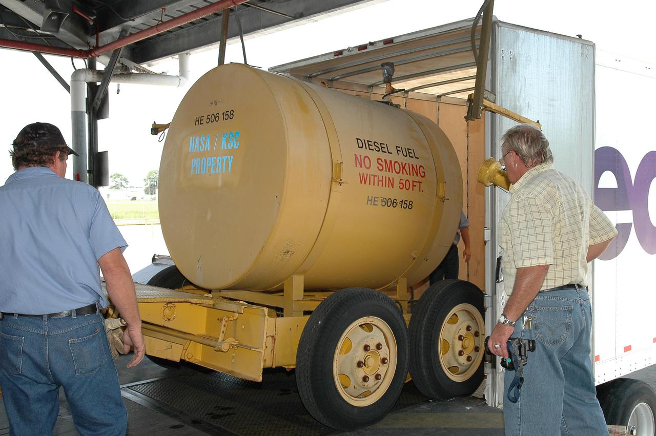 KENNEDY SPACE CENTER, FLA.  - A container of diesel fuel is loaded onto a truck for a trip to Stennis Space Center in Mississippi.  Stennis suffered damage and power outages from Hurricane Katrina.   KSC is sending a helicopter with medical supplies and an Emergency Medical Technician to Stennis, plus a 1-megawatt generator, 125- and 225-kilowatt generators, and 1,000 gallons of diesel fuel.  Michoud Assembly Facility near New Orleans was also left without power .  A NASA plane is carrying medical supplies, food and chain saws, as well as a physician and two high voltage technicians to Michoud to ensure the facility can safely receive power when the main electricity grid comes online.  In addition, a 14-person security team is also going to Michoud to relieve the security professionals at that location.