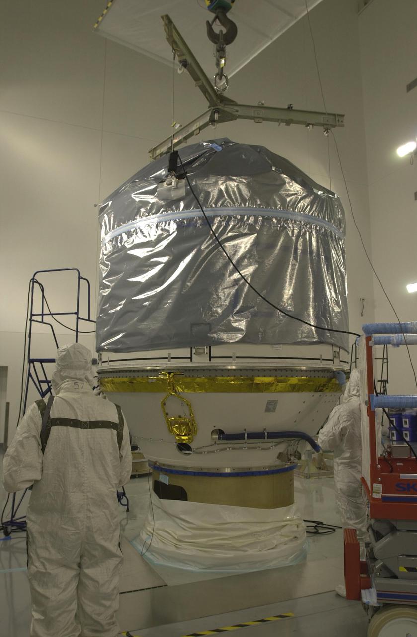 VANDENBERG AIR FORCE BASE, CALIF. - Inside the Astrotech Payload Processing Facility on Vandenberg Air Force Base in California, the upper Delta Payload Attach Fitting (UDPAF) has been mated with the lower Delta Payload Attach Fitting (LDPAF). The LDPAF holds the CloudSat satellite and the UDPAF will hold the CALIPSO satellite. CALIPSO stands for Cloud-Aerosol Lidar and Infrared Pathfinder Satellite Observation. CALIPSO and CloudSat are highly complementary satellites that will provide never-before-seen 3-D perspectives of how clouds and aerosols form, evolve, and affect weather and climate. CALIPSO and CloudSat will fly in formation with three other satellites in the A-train constellation to enhance understanding of our climate system. Launch of CALIPSO_CloudSat aboard a Boeing Delta II rocket is scheduled for 3:01 a.m. PDT Sept. 29.