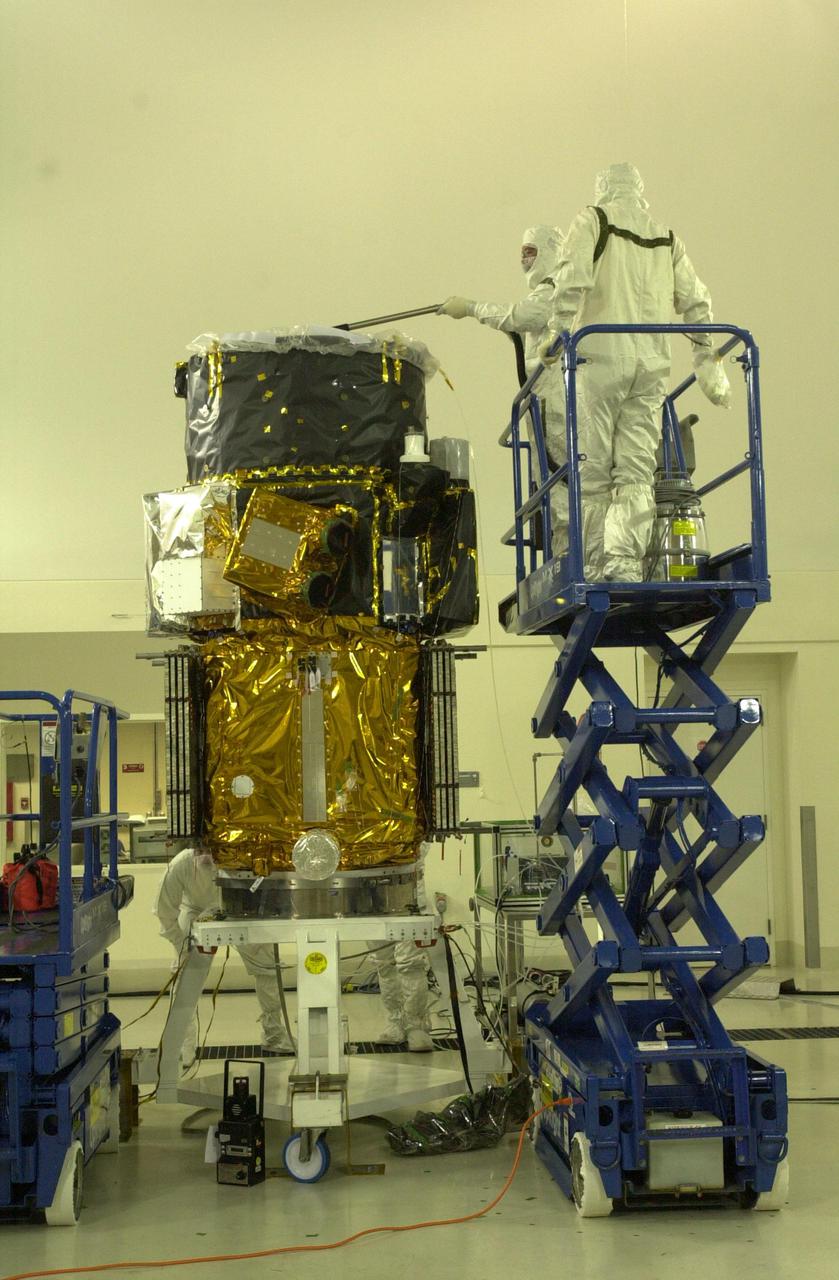 VANDENBERG AIR FORCE BASE, CALIF. - Inside the Astrotech Payload Processing Facility on Vandenberg Air Force Base in California, the CALIPSO spacecraft is prepared for weighing. CALIPSO stands for Cloud-Aerosol Lidar and Infrared Pathfinder Satellite Observation. It will fly in combination with the CloudSat satellite to provide never-before-seen 3-D perspectives of how clouds and aerosols form, evolve, and affect weather and climate. CALIPSO and CloudSat will join three other satellites in orbit to enhance understanding of climate systems. The two satellites will launch aboard a Boeing Delta II rocket no earlier than Oct. 1 from Space Launch Complex 2 at Vandenberg.