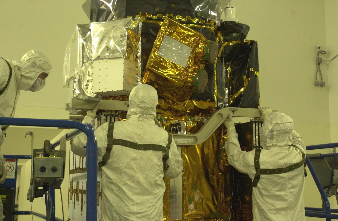 VANDENBERG AIR FORCE BASE, CALIF. - Inside the Astrotech Payload Processing Facility on Vandenberg Air Force Base in California, workers prepare the CALIPSO spacecraft for weighing. CALIPSO stands for Cloud-Aerosol Lidar and Infrared Pathfinder Satellite Observation. It will fly in combination with the CloudSat satellite to provide never-before-seen 3-D perspectives of how clouds and aerosols form, evolve, and affect weather and climate. CALIPSO and CloudSat will join three other satellites in orbit to enhance understanding of climate systems. The two satellites will launch aboard a Boeing Delta II rocket no earlier than Oct. 1 from Space Launch Complex 2 at Vandenberg.