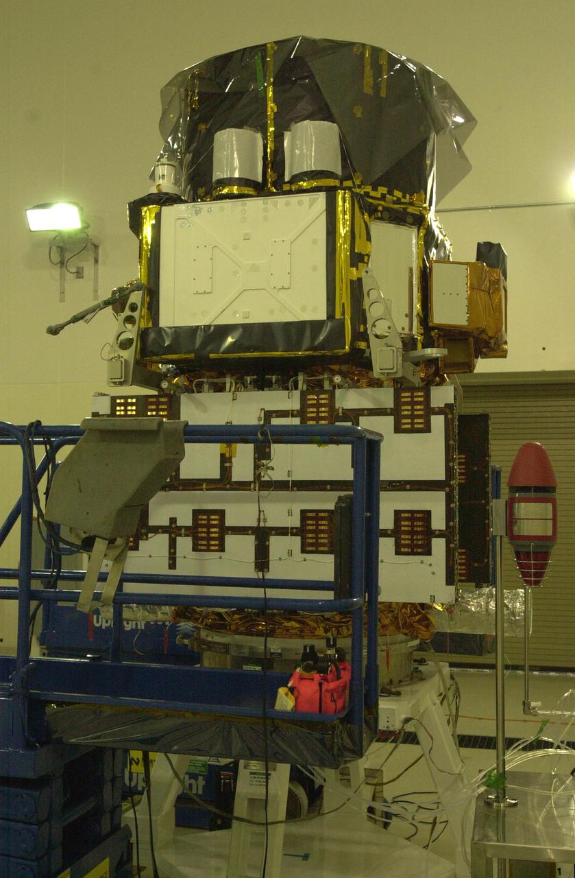 VANDENBERG AIR FORCE BASE, CALIF. - Inside the Astrotech Payload Processing Facility on Vandenberg Air Force Base in California, the CALIPSO spacecraft waits to be weighed. CALIPSO stands for Cloud-Aerosol Lidar and Infrared Pathfinder Satellite Observation. It will fly in combination with the CloudSat satellite to provide never-before-seen 3-D perspectives of how clouds and aerosols form, evolve, and affect weather and climate. CALIPSO and CloudSat will join three other satellites in orbit to enhance understanding of climate systems. The two satellites will launch aboard a Boeing Delta II rocket no earlier than Oct. 1 from Space Launch Complex 2 at Vandenberg.