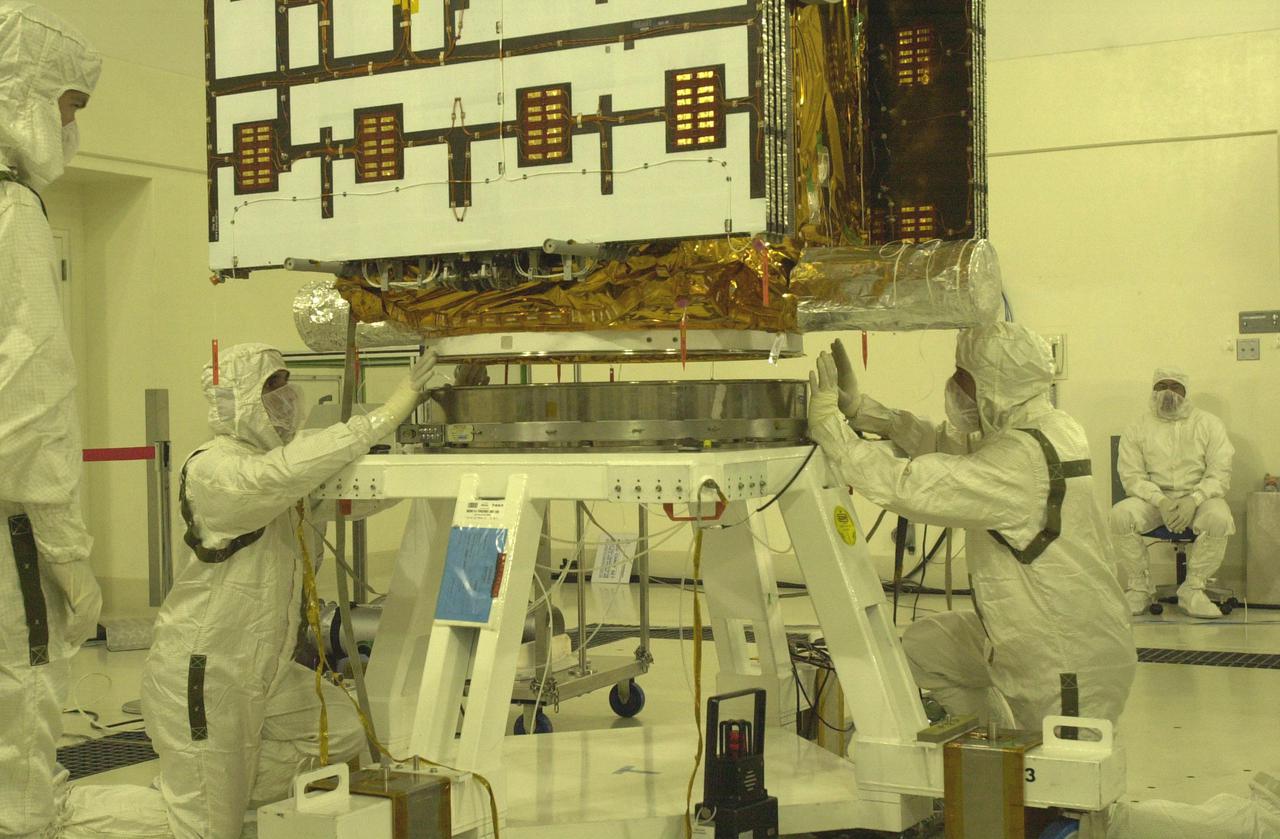 VANDENBERG AIR FORCE BASE, CALIF. - Inside the Astrotech Payload Processing Facility on Vandenberg Air Force Base in California, workers prepare the CALIPSO spacecraft for weighing. CALIPSO stands for Cloud-Aerosol Lidar and Infrared Pathfinder Satellite Observation. It will fly in combination with the CloudSat satellite to provide never-before-seen 3-D perspectives of how clouds and aerosols form, evolve, and affect weather and climate. CALIPSO and CloudSat will join three other satellites in orbit to enhance understanding of climate systems. The two satellites will launch aboard a Boeing Delta II rocket no earlier than Oct. 1 from Space Launch Complex 2 at Vandenberg.