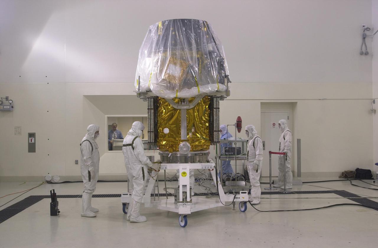 VANDENBERG AIR FORCE BASE, CALIF. —  Inside the Astrotech Payload Processing Facility on Vandenberg Air Force Base in California, the CALIPSO spacecraft is being prepared for mating with the upper Delta Payload Attach Fitting (UDPAF).  Later the UDPAF will be mated with the lower Delta Payload Attach Fitting, which contains the CloudSat satellite.  The PAF is the interface between the spacecraft and the second stage of the rocket.  CALIPSO stands for Cloud-Aerosol Lidar and Infrared Pathfinder Satellite Observation. CALIPSO and CloudSat are highly complementary satellites that will provide never-before-seen 3-D perspectives of how clouds and aerosols form, evolve, and affect weather and climate. CALIPSO and CloudSat will fly in formation with three other satellites in the A-train constellation to enhance understanding of our climate system. Launch of CALIPSO_CloudSat aboard a Boeing Delta II rocket is scheduled for 3:01 a.m. PDT Sept. 29.