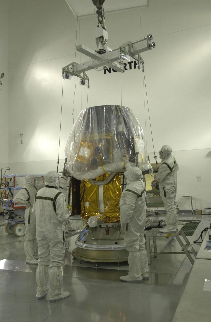 VANDENBERG AIR FORCE BASE, CALIF.  - Inside the Astrotech Payload Processing Facility on Vandenberg Air Force Base in California, the CALIPSO spacecraft is being fitted with a crane to lift and move the satellite for mating with the Lower Delta Payload Attach Fitting (LDPAF),  which contains the CloudSat satellite. The PAF is the interface between the spacecraft and the second stage of the rocket.  CALIPSO stands for Cloud-Aerosol Lidar and Infrared Pathfinder Satellite Observation. CALIPSO and CloudSat are highly complementary satellites that will provide never-before-seen 3-D perspectives of how clouds and aerosols form, evolve, and affect weather and climate. CALIPSO and CloudSat will fly in formation with three other satellites in the A-train constellation to enhance understanding of our climate system. Launch of CALIPSO_CloudSat aboard a Boeing Delta II rocket is scheduled for 3:01 a.m. PDT Sept. 29.