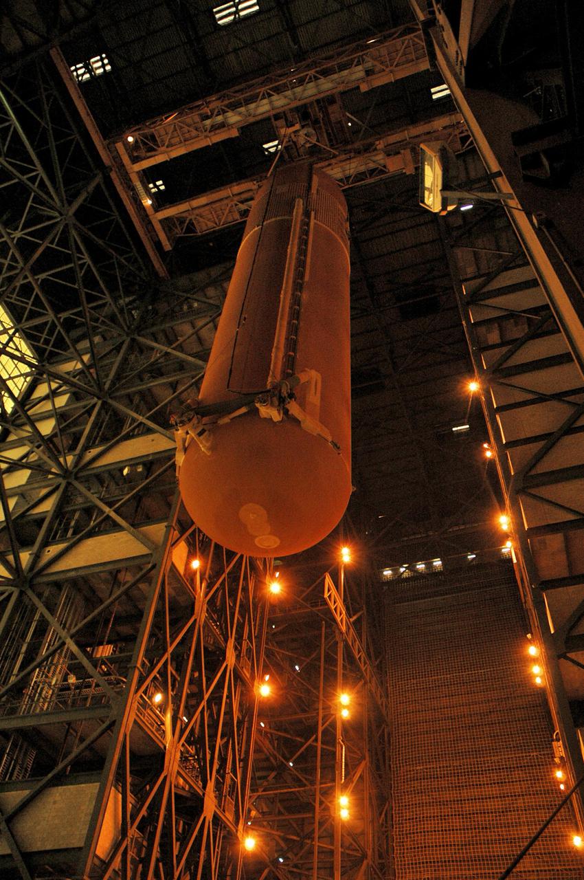 KENNEDY SPACE CENTER, FLA. - In NASA Kennedy Space Center’s Vehicle Assembly Building, an external tank is lifted into the upper levels of the high bay after being demated from the solid rocket boosters originally scheduled to fly on mission STS-121 with Space Shuttle Atlantis. It will temporarily be stored in a checkout cell in the VAB and await assignment to a future mission.
