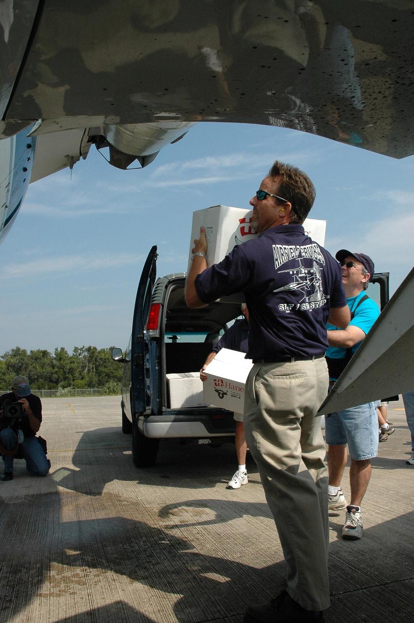 KENNEDY SPACE CENTER, FLA. - At the NASA Kennedy Space Center Shuttle Landing Facility, employees load hurricane relief supplies onto a NASA aircraft bound for Stennis Space Center in Mississippi, which suffered damage from Hurricane Katrina. The supplies included 10 boxes of load bus disconnects going to Michoud Assesmbly Facility near New Orleans and 17 boxes of personal hygiene items, along with boxes of clothing and water. Many Stennis and Michoud employees were rendered homeless by the hurricane. NASA centers have been generous with relief supplies and personnel. Stennis is in limited operations mode. Daily convoys have been moving between Stennis and Michould, transporting personnel and supplies as Michoud prepares to resume limited operations.